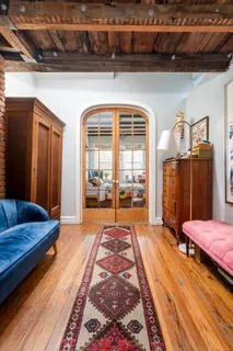 a lobby with furniture and a rug