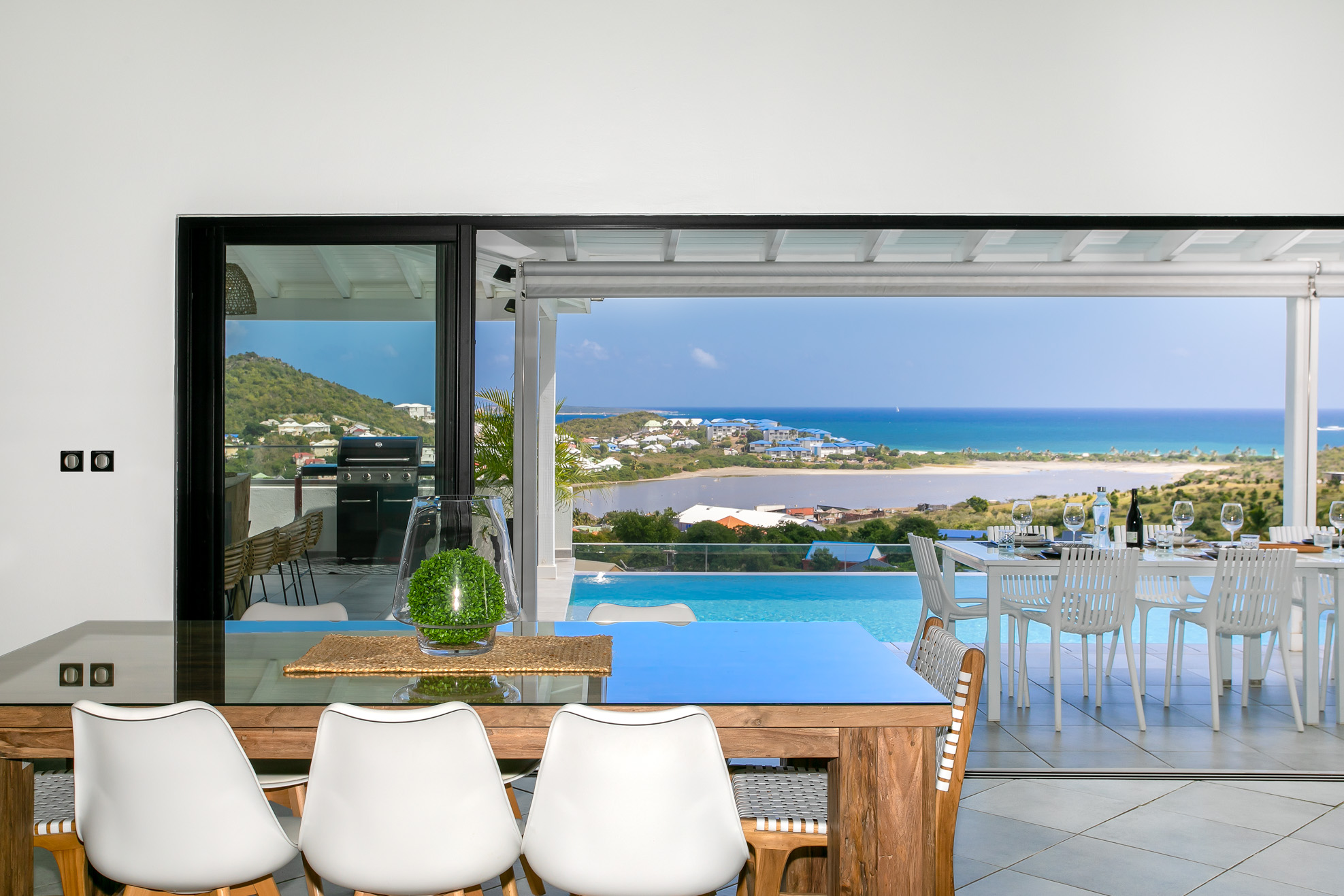 3 Rue Du Mont Vernon St. Martin, undefined 97150 - Photo 30 of 40 a living room with patio furniture and a floor to ceiling window