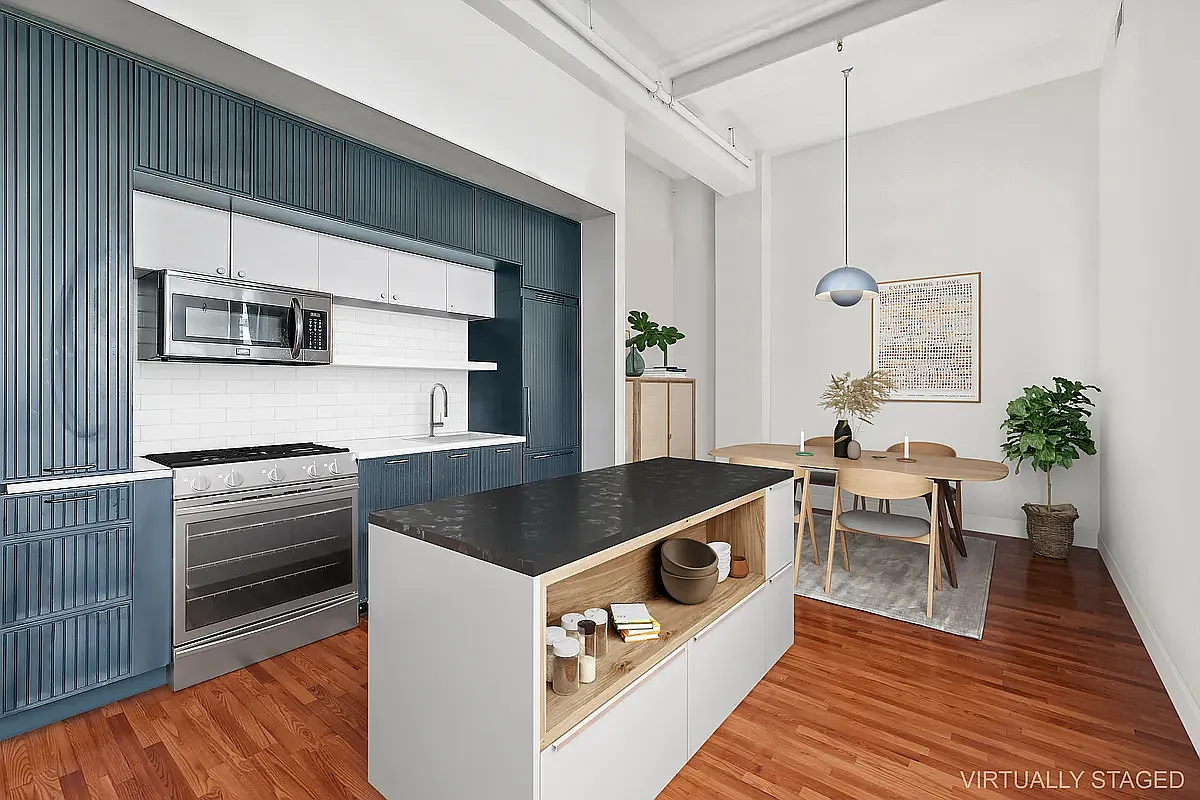 180 Bainbridge Street, Unit 401 Brooklyn, NY 11233 - Photo 2 of 23 a kitchen with stainless steel appliances granite countertop a stove a sink and a microwave