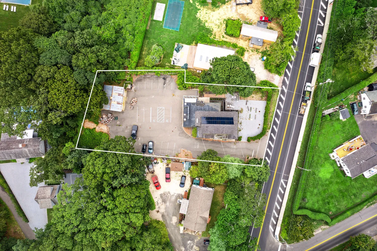 an aerial view of house with yard swimming pool and outdoor seating
