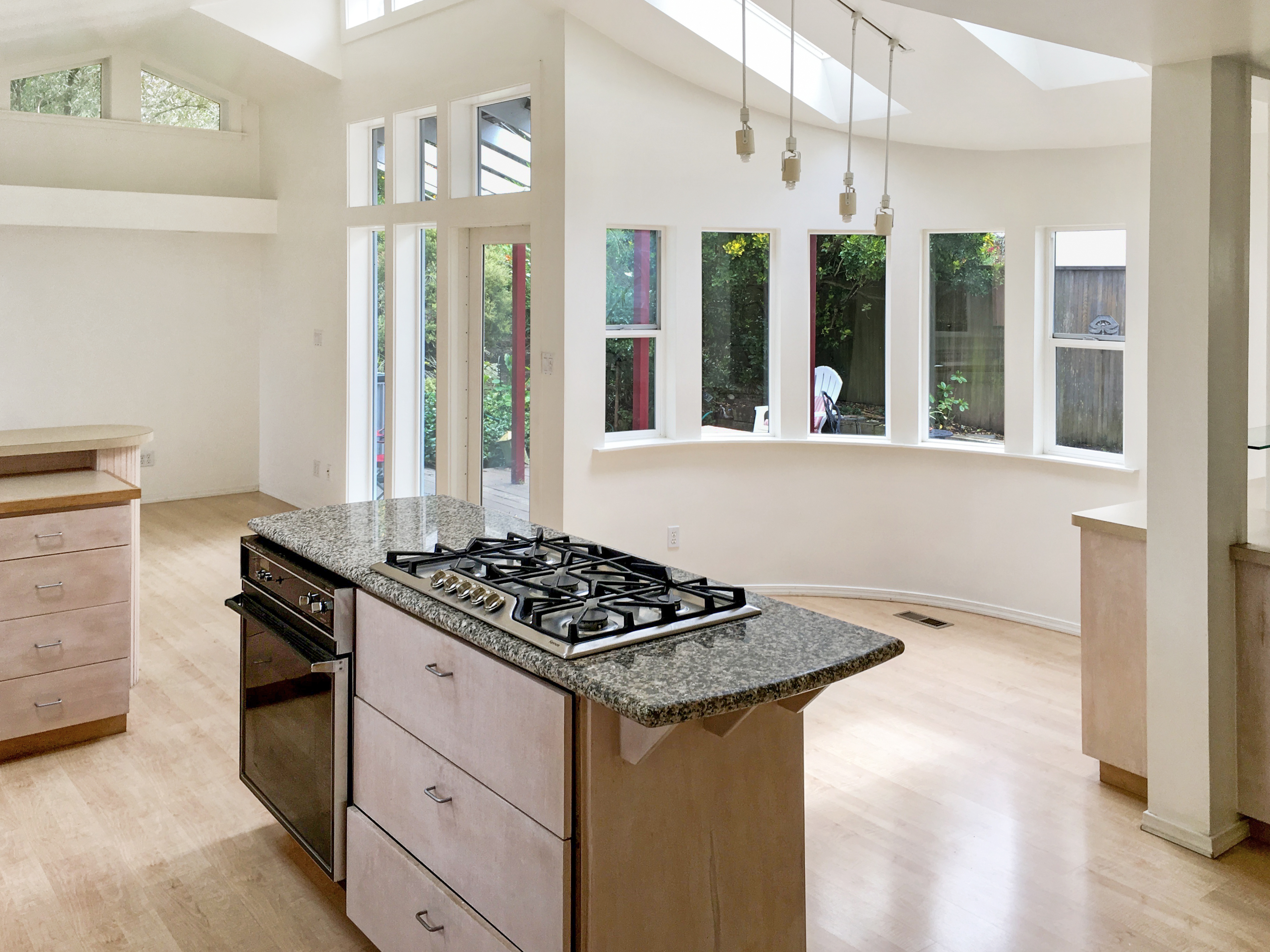 371 Inverness Drive Pacifica, CA 94044 - Photo 8 of 15 a kitchen view of a kitchen island wooden floor and a window