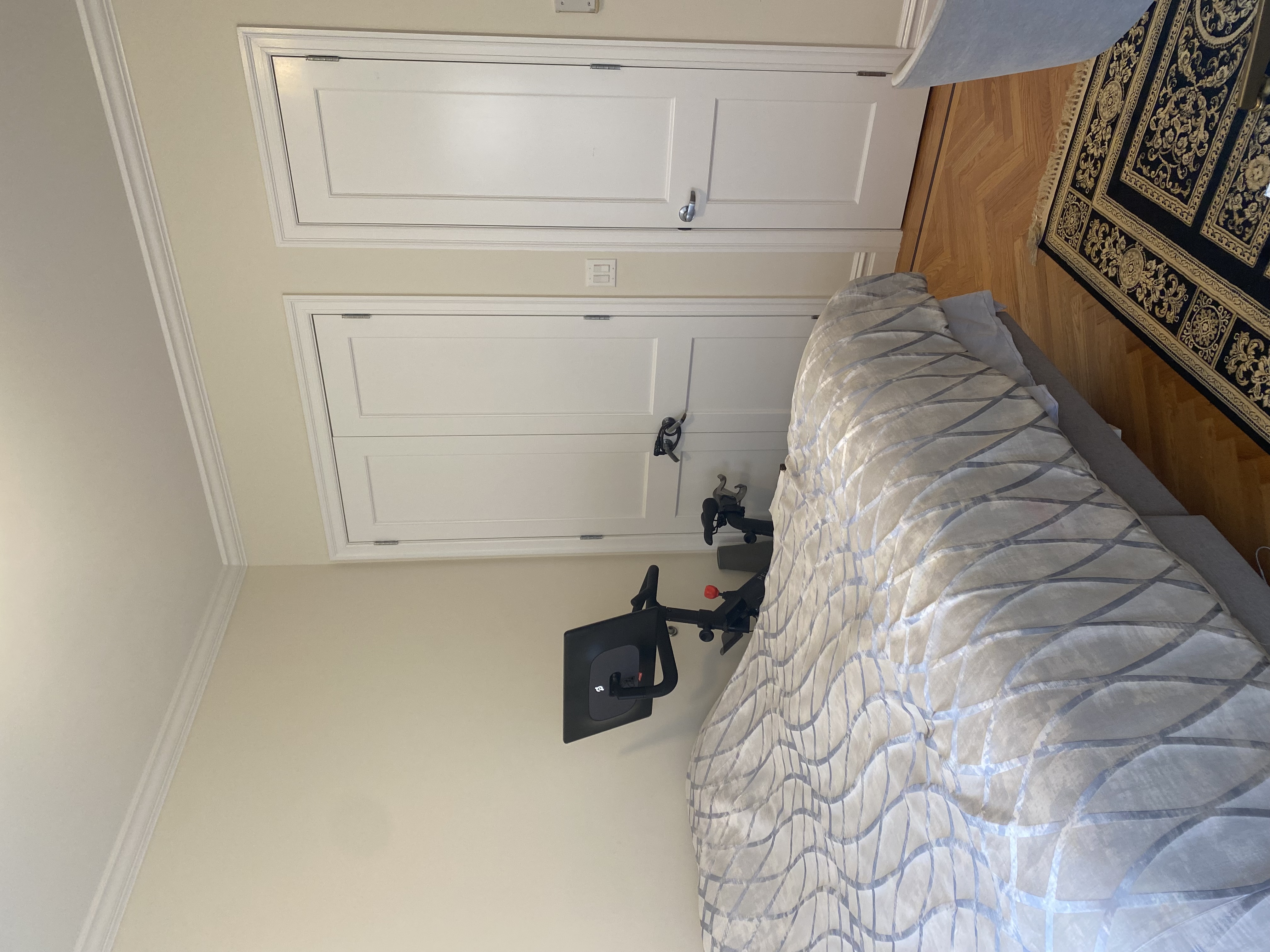 1240 Park Avenue, Unit 6B Manhattan, NY 10128 - Photo 8 of 13 a bedroom with a bed and wooden floor