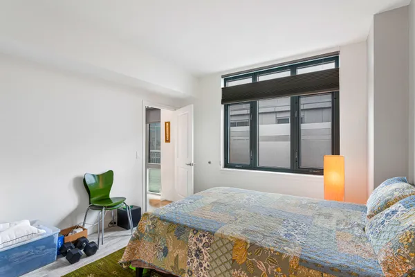a bedroom with a bed and a closet