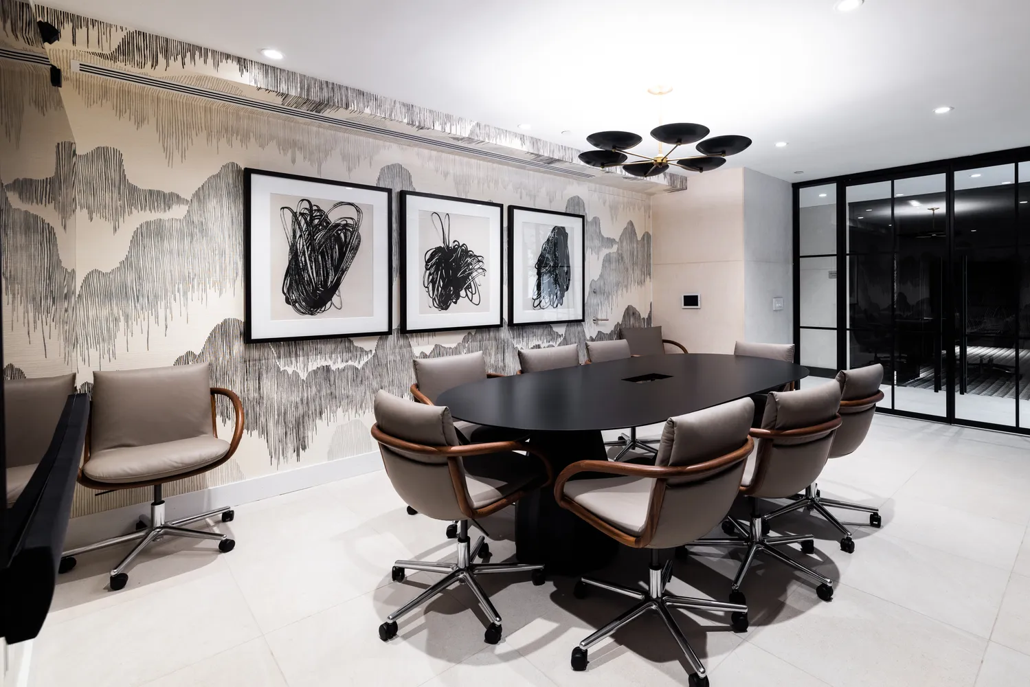 a work room with furniture and a large window