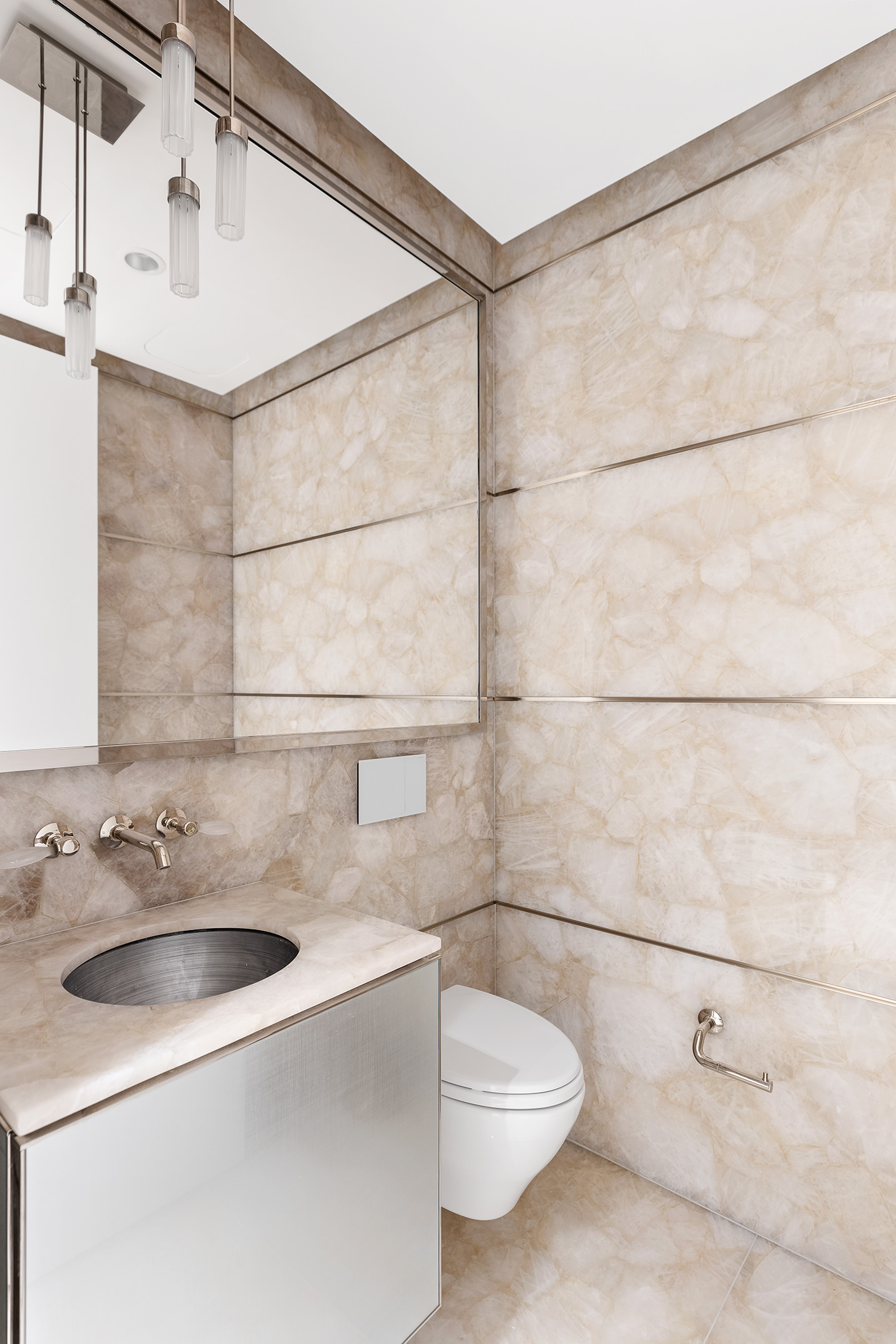217 West 57th Street, Unit 60W Manhattan, NY 10019 - Photo 14 of 27 a bathroom with a sink and mirror
