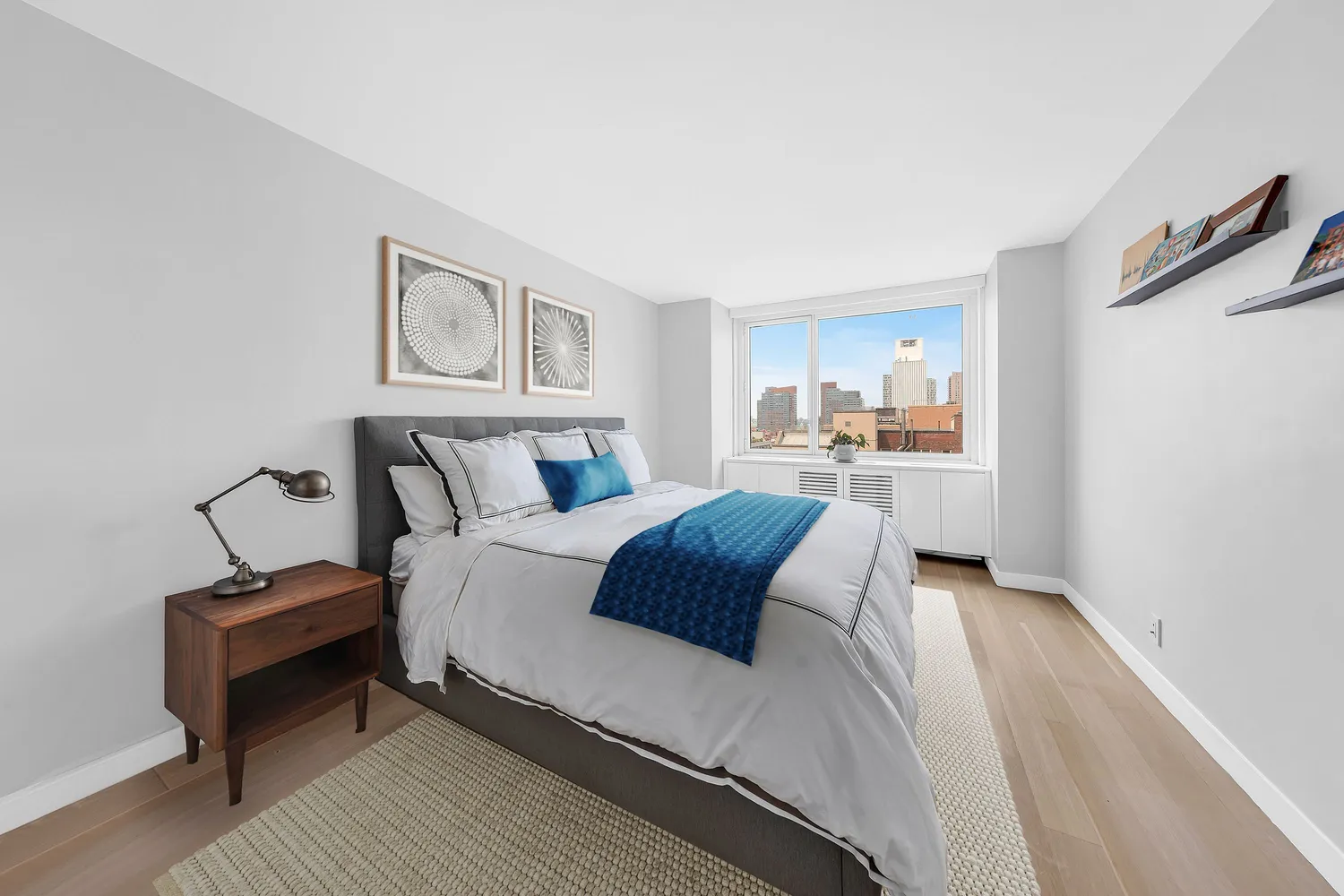 a bedroom with a bed and a night stand