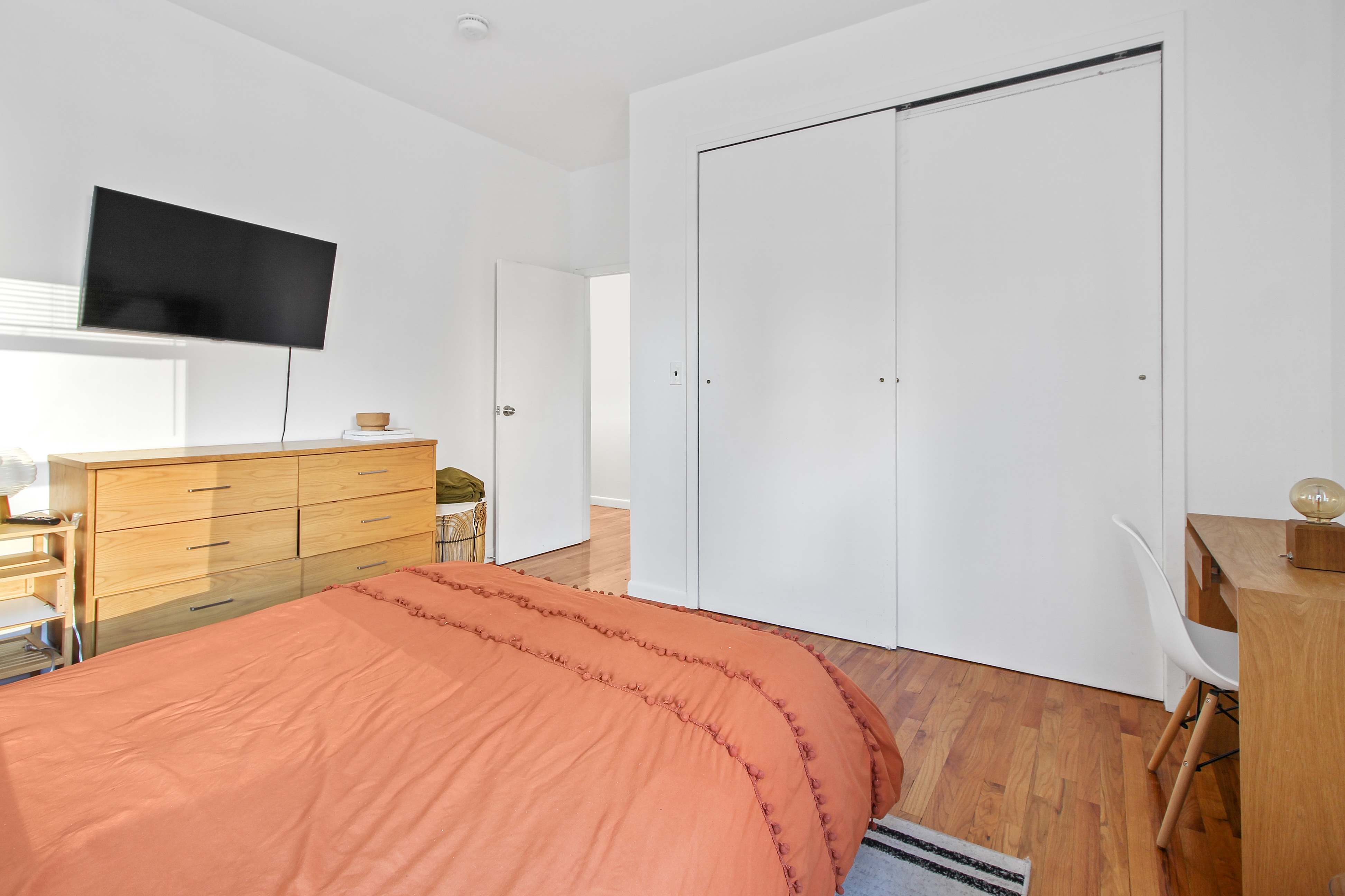 621 2nd Avenue, Unit 2 Manhattan, NY 10016 - Photo 2 of 8 a bedroom with a bed and a flat screen tv
