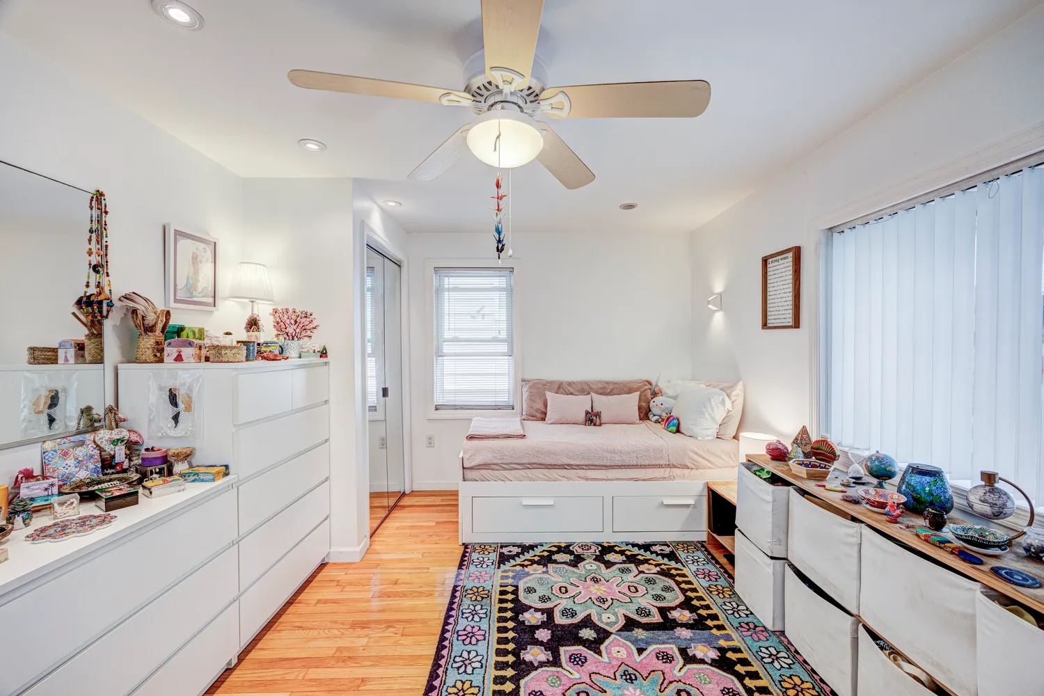 a room with a baby crib and a window