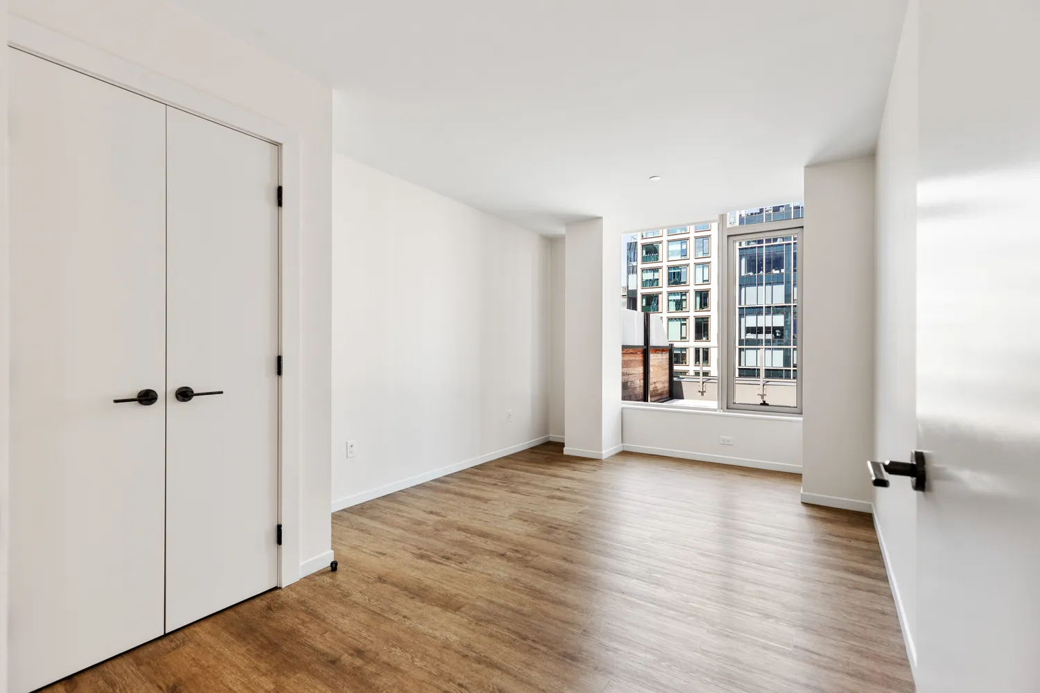 a view of livingroom with hardwood floor and hallway