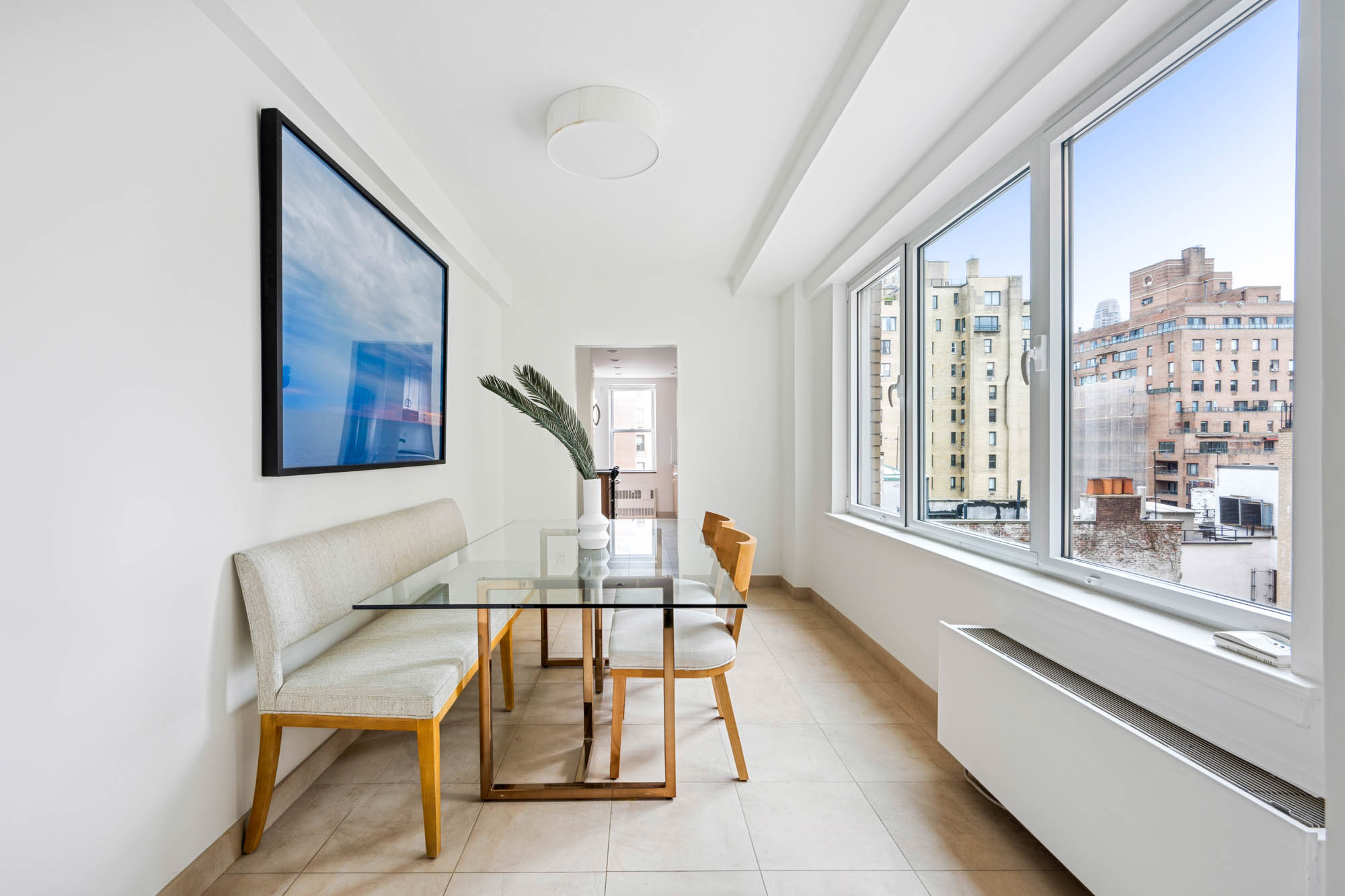 936 5th Avenue, Unit 10AB Manhattan, NY 10021 - Photo 24 of 37 a living room with furniture and a large window