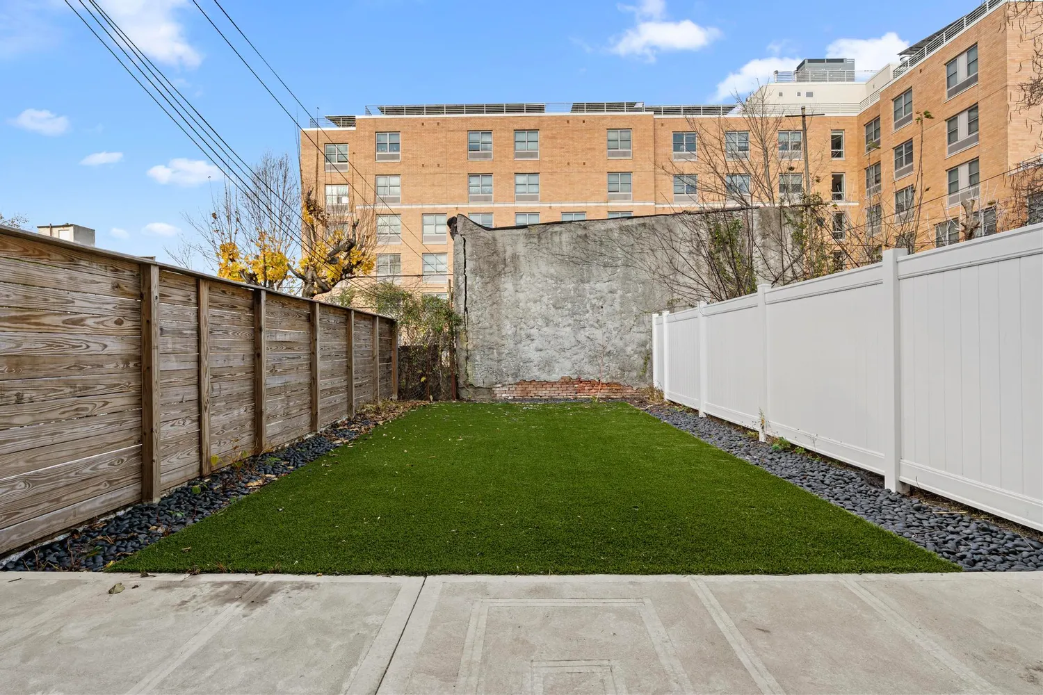 a view of a back yard of the building