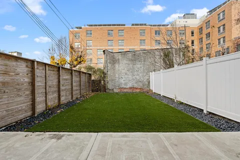 a view of a back yard of the building