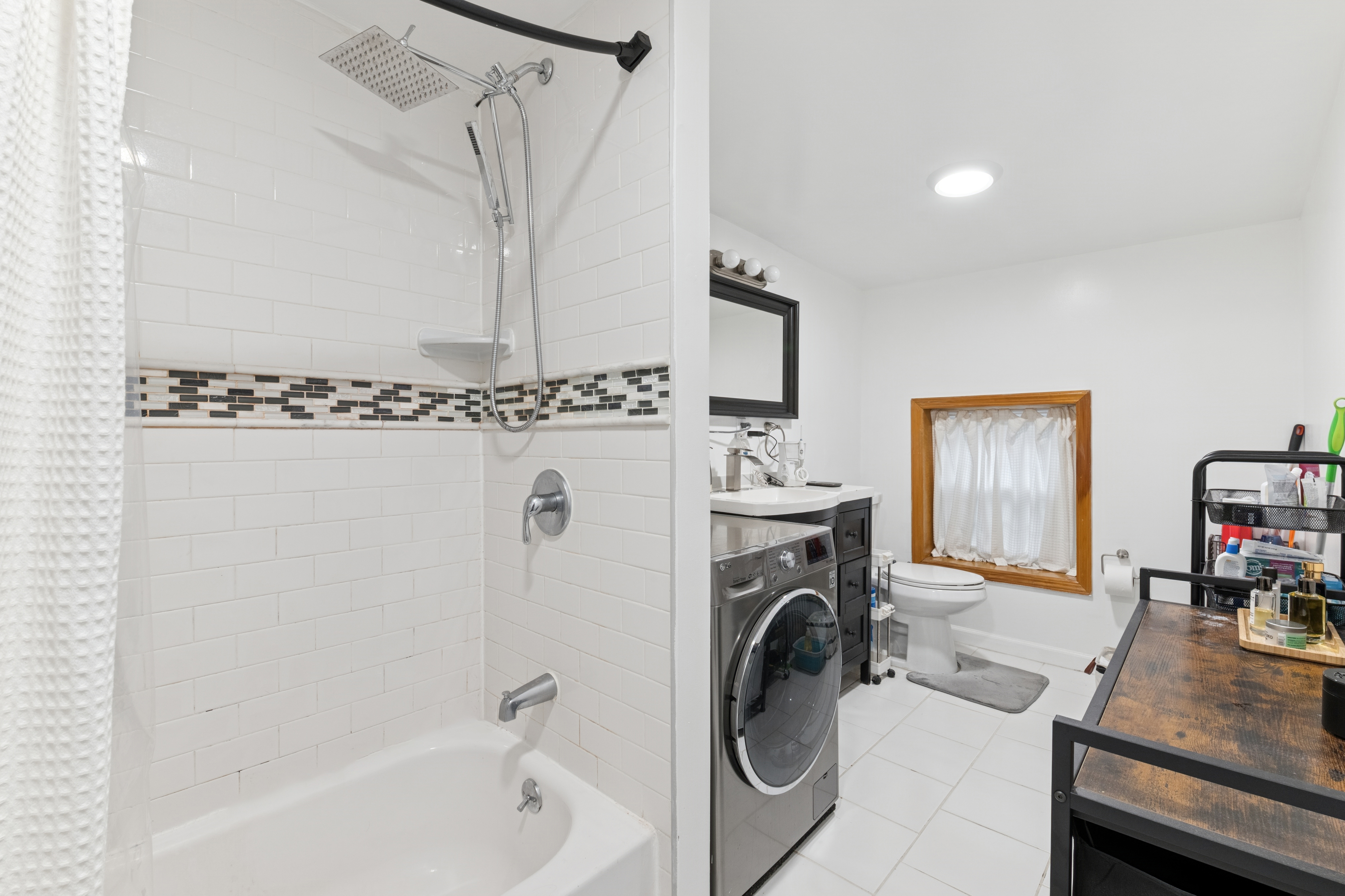 514 Classon Avenue, Unit 3 Brooklyn, NY 11238 - Photo 3 of 7 a view of a bedroom with washer and dryer