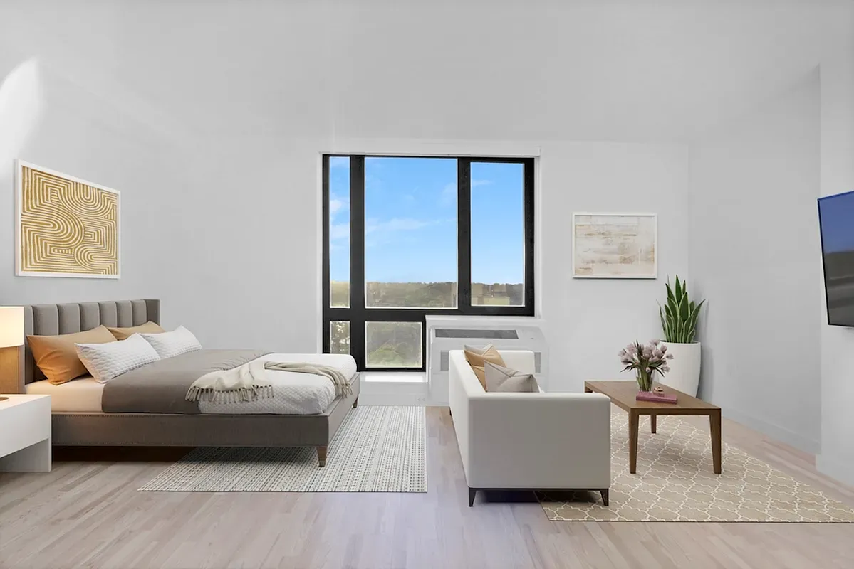 a living room with furniture and a large window