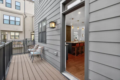 a balcony view with a outdoor seating space
