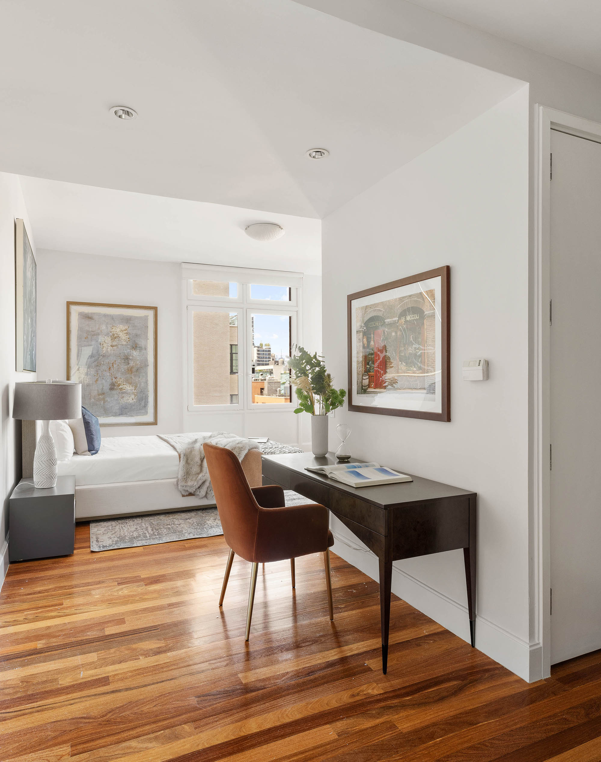 92 Laight Street, Unit 11A Manhattan, NY 10013 - Photo 7 of 15 a living room with furniture and a wooden floor