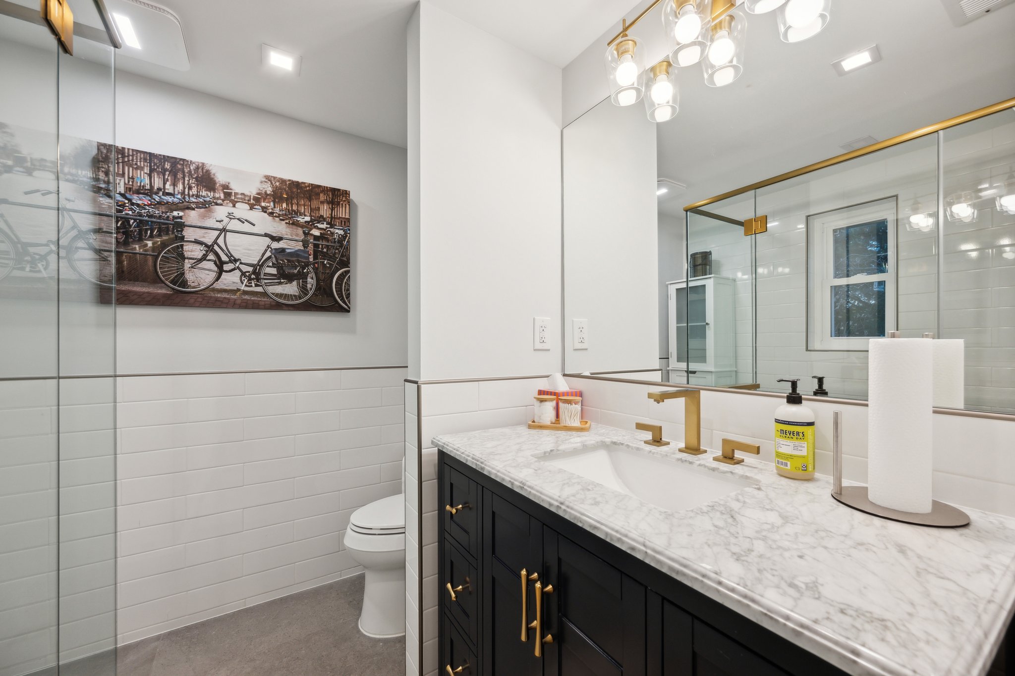2607 Ross Road Chevy Chase, MD 20815 - Photo 30 of 37 a bathroom with a granite countertop sink a toilet and a mirror