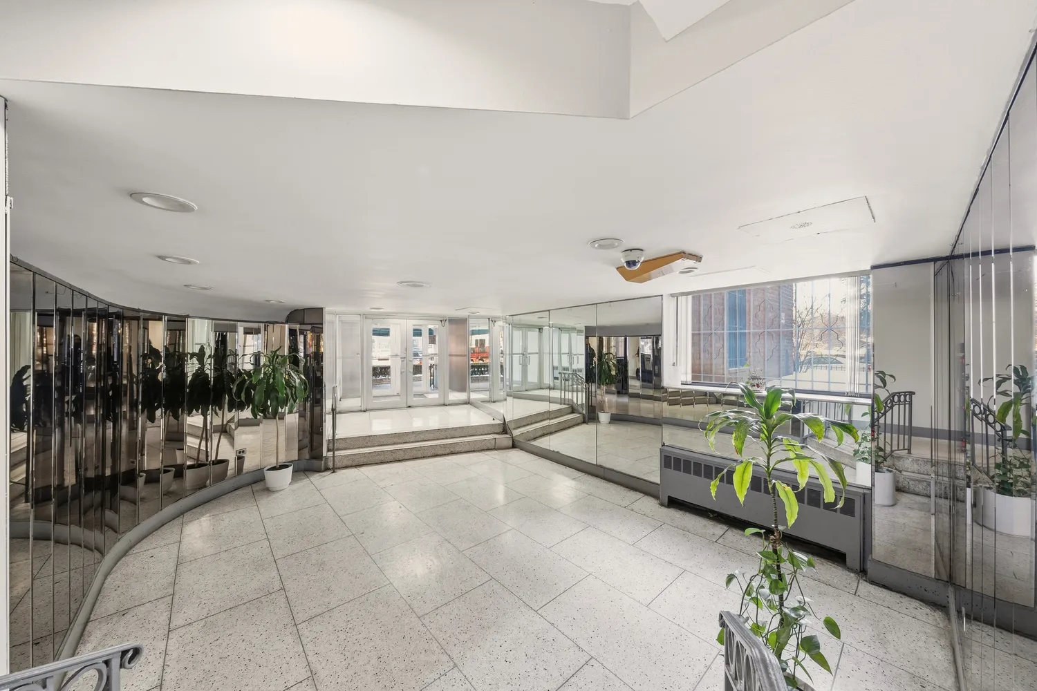 a lobby with furniture and window