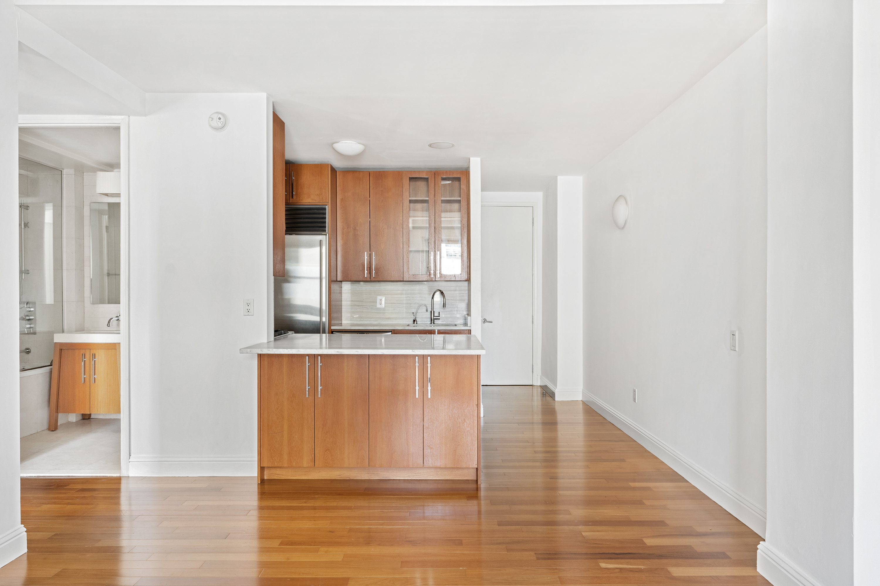 88 Greenwich Street, Unit 1212 Manhattan, NY 10006 - Photo 1 of 10 a spacious bathroom with mirror and