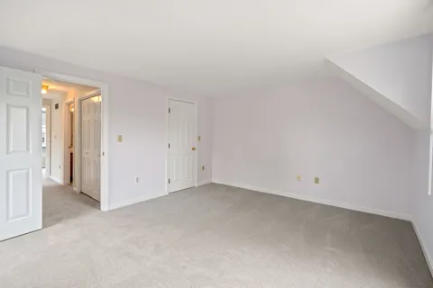 an empty room with a hallway