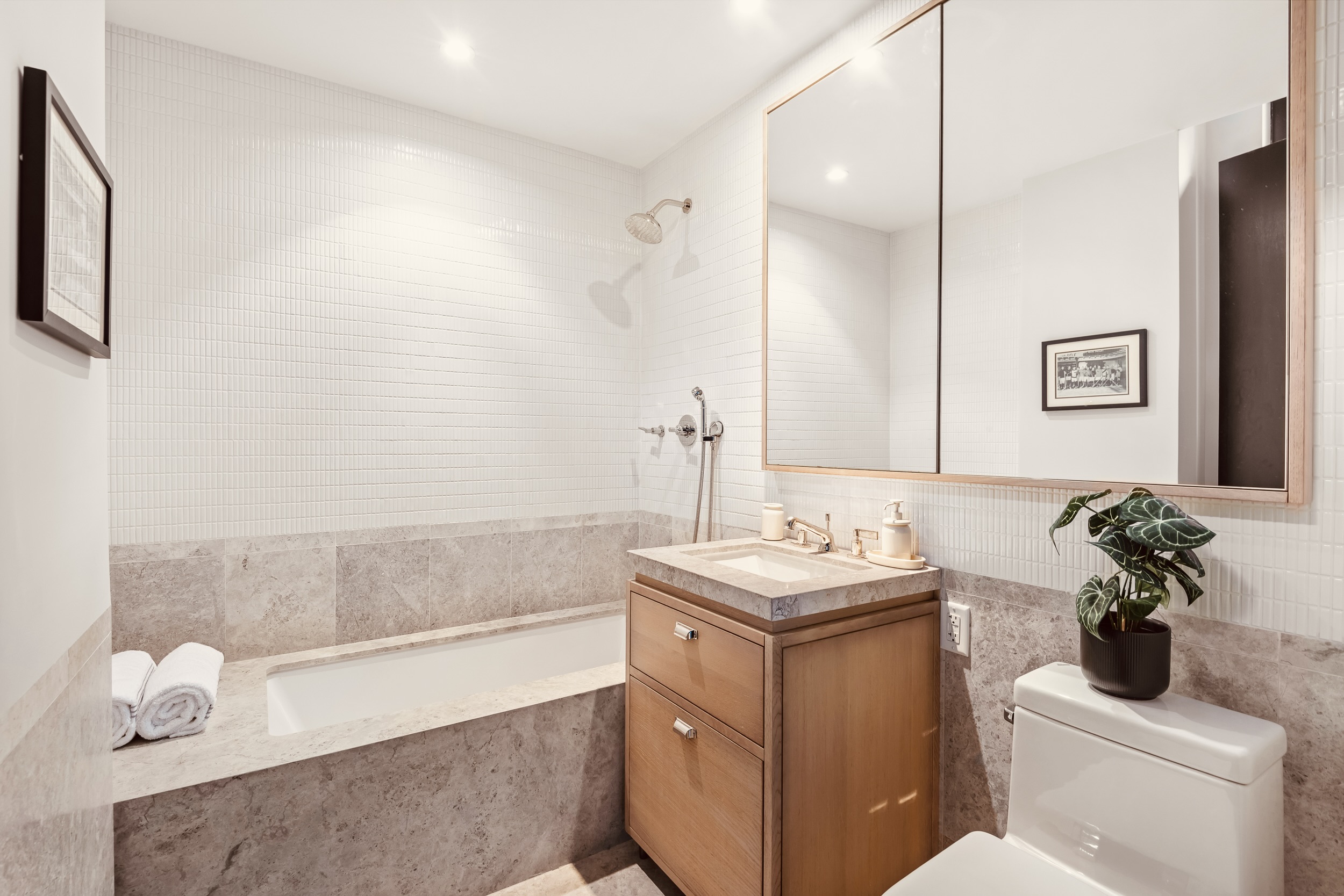 51 Jay Street, Unit 5J Brooklyn, NY 11201 - Photo 12 of 15 a bathroom with a sink a toilet and mirror