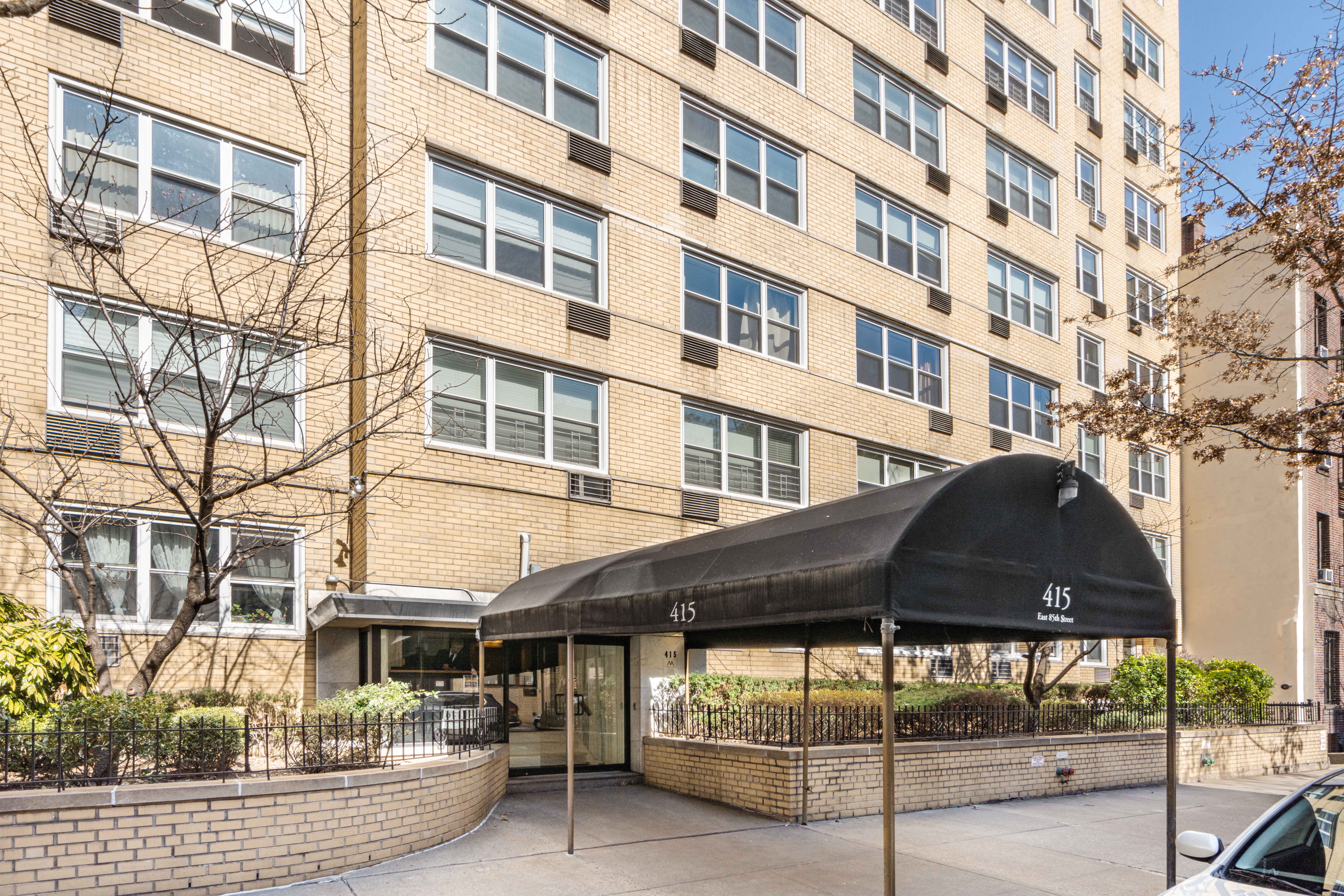 415 East 85th Street, Unit 5J Manhattan, NY 10028 - Photo 16 of 19 a front view of a building with glass windows