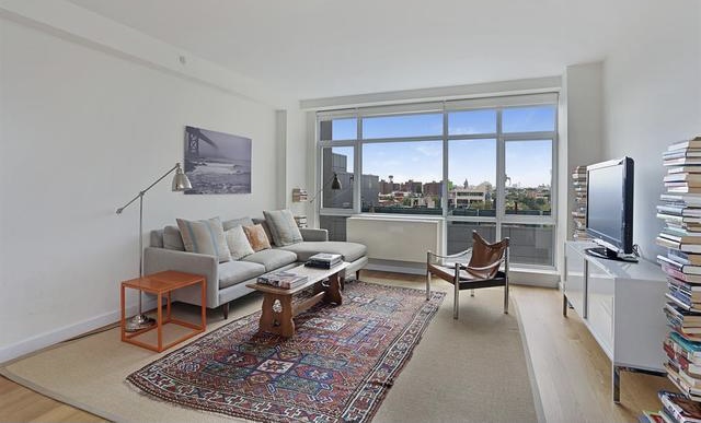 189 Schermerhorn Street, Unit 7D Brooklyn, NY 11201 - Photo 1 of 5 a living room with furniture wooden floor and a flat screen tv