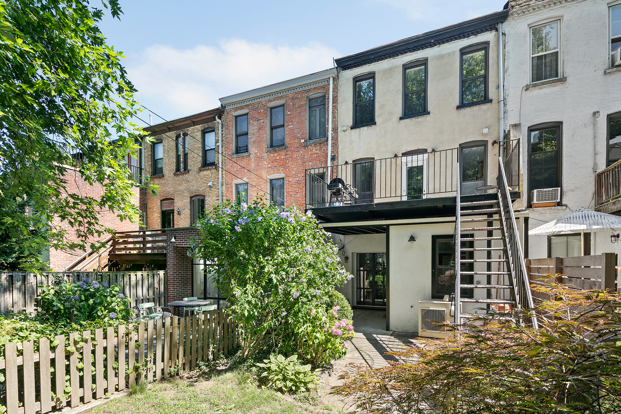 428 5th Street Brooklyn, NY 11215 - Photo 24 of 26 a front view of a house with a garden
