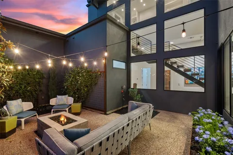 a view of an chairs and tables in the balcony
