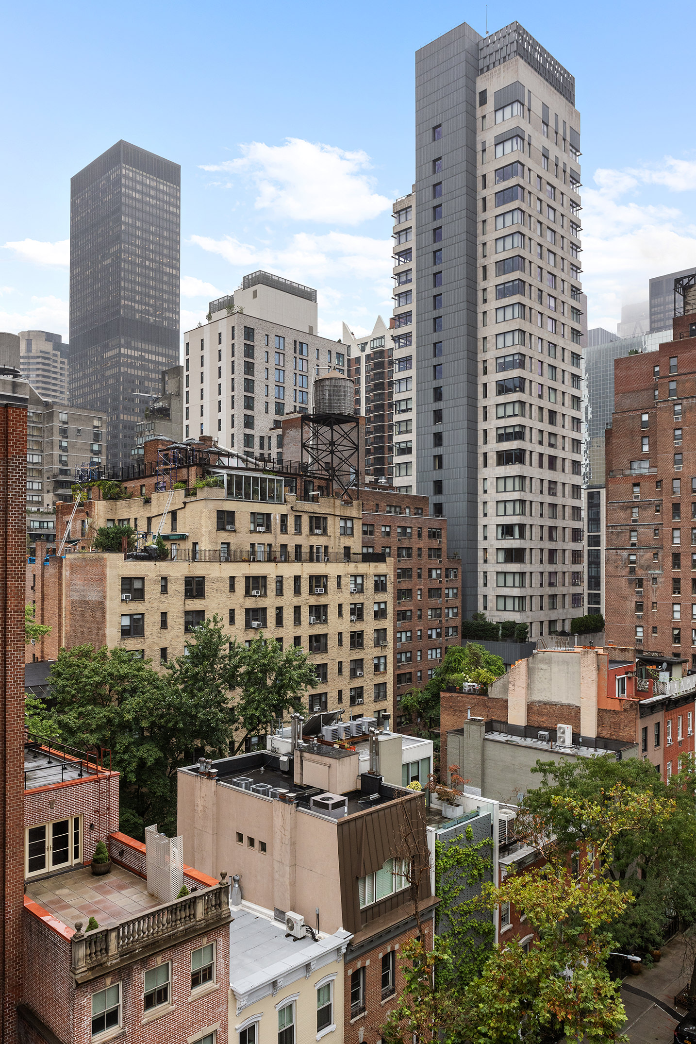 335 East 51st Street, Unit 9D Manhattan, NY 10022 - Photo 11 of 14 a view of a city with tall buildings
