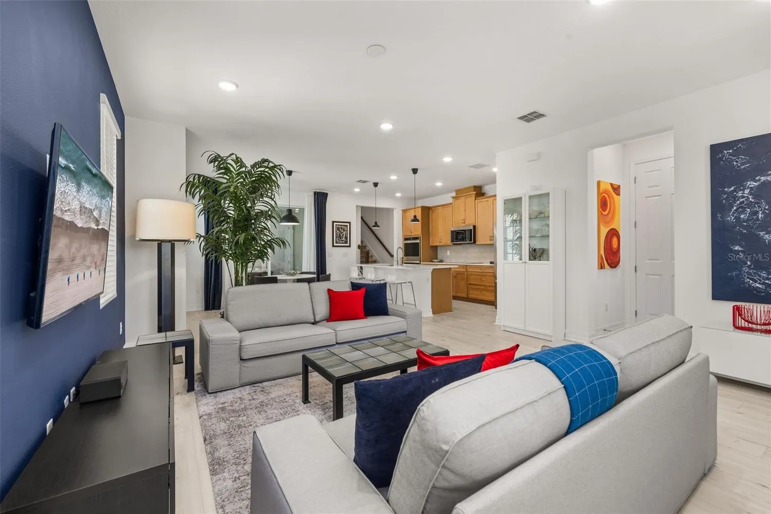 a living room with furniture and a flat screen tv