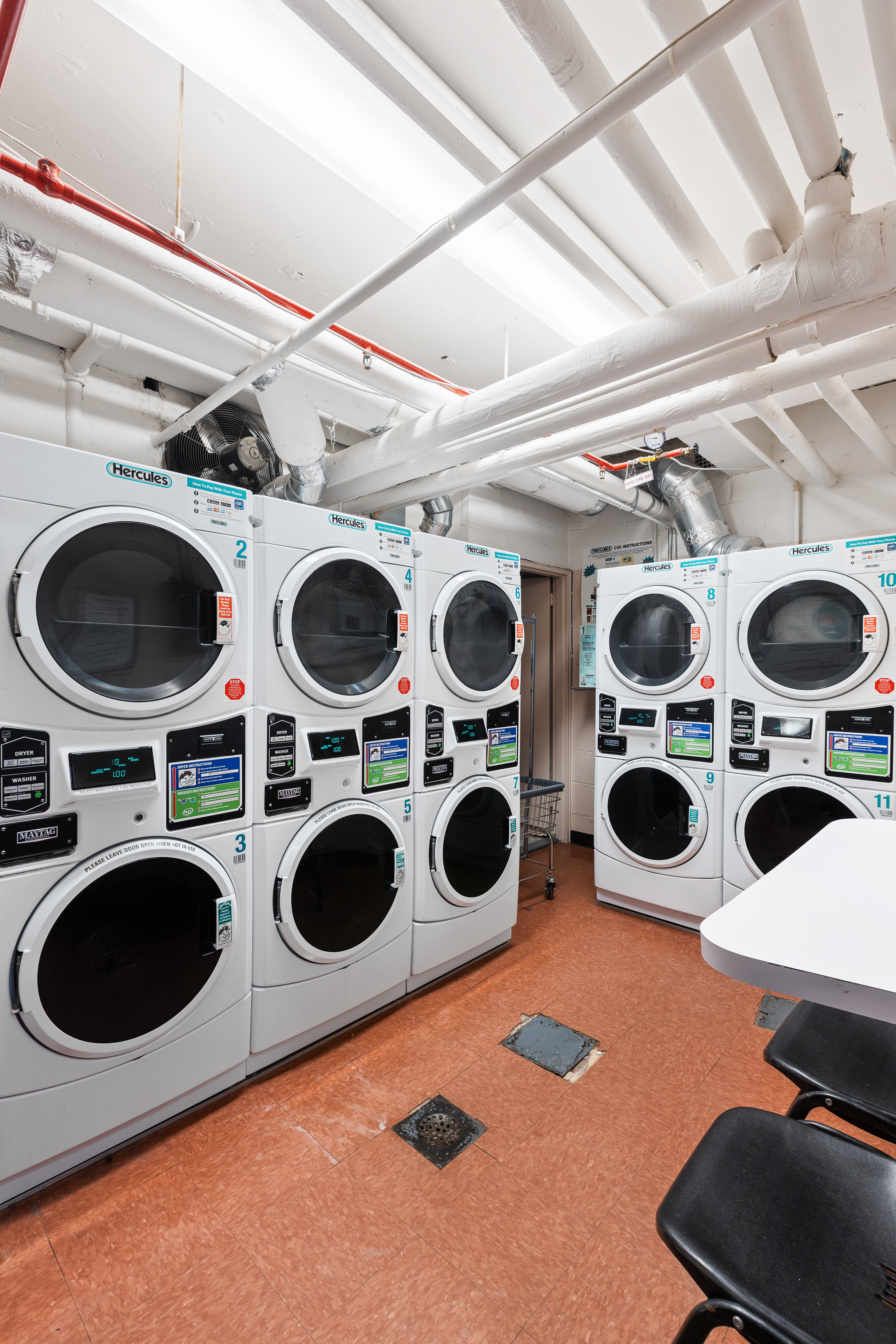210 East 36th Street, Unit PHC Manhattan, NY 10016 - Photo 12 of 13 a utility room with dryer and washer