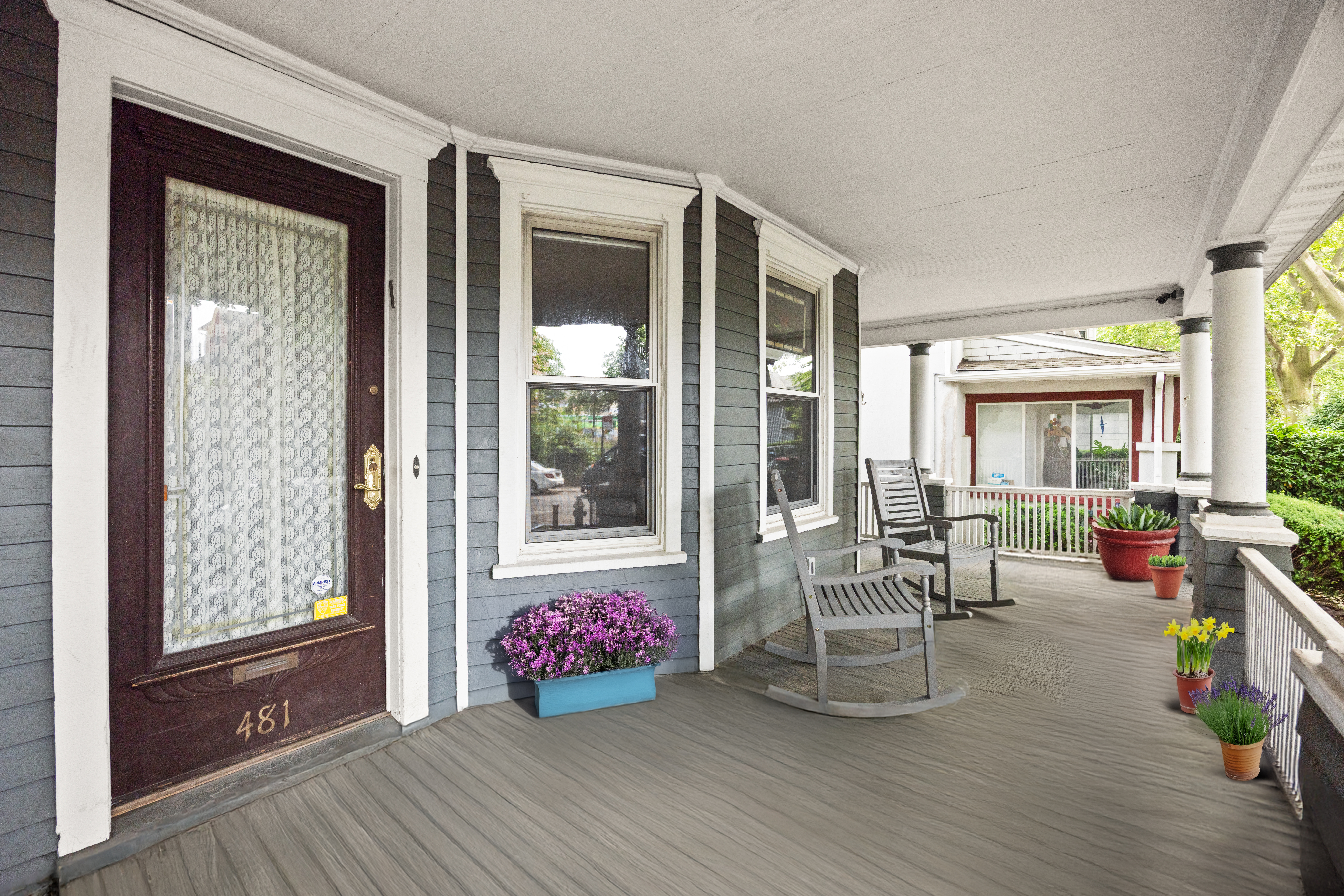 481 Stratford Road Brooklyn, NY 11218 - Photo 2 of 25 a living room with furniture and a floor to ceiling window