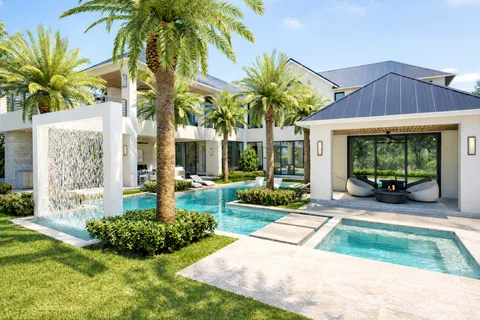 a view of a house with backyard and sitting area