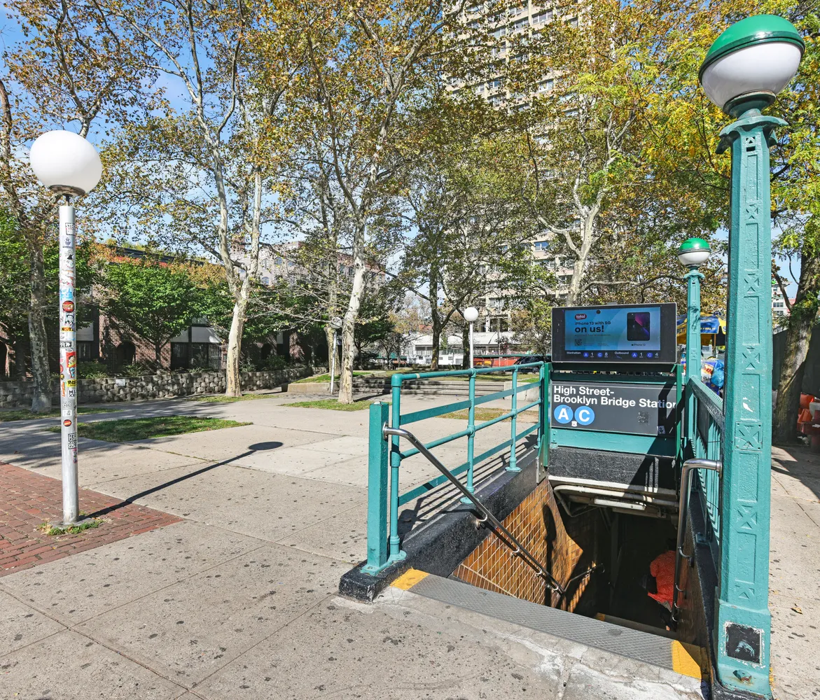 a view of a bench in the patio next to a yard