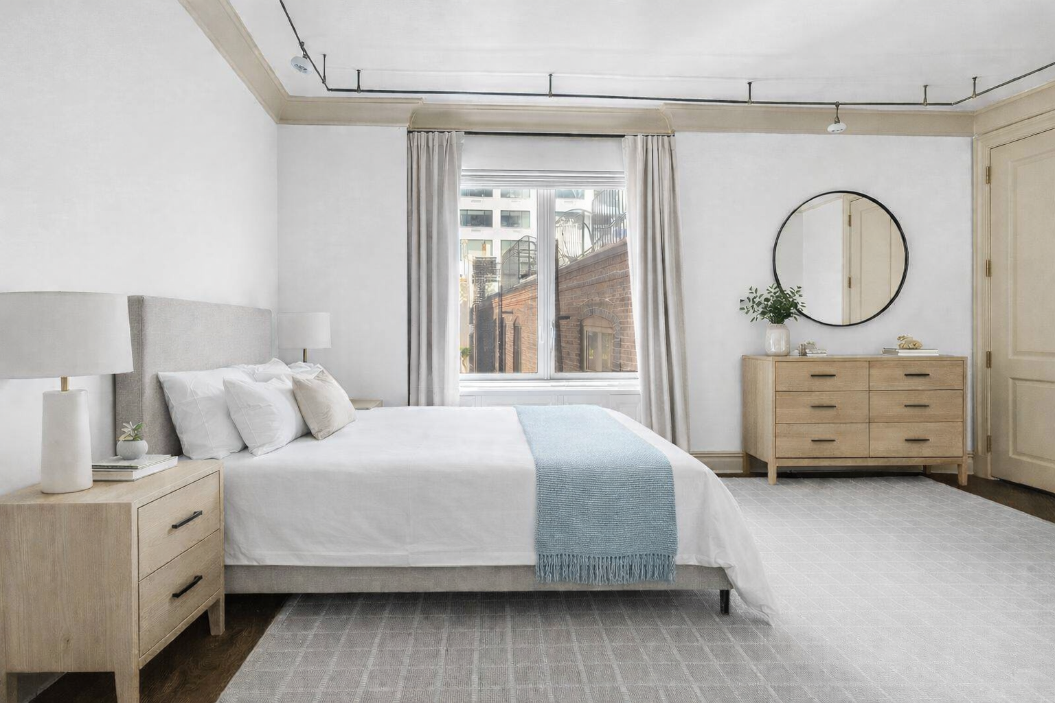 181 East 65th Street, Unit 5B Manhattan, NY 10065 - Photo 4 of 14 a bedroom with a bed and a closet