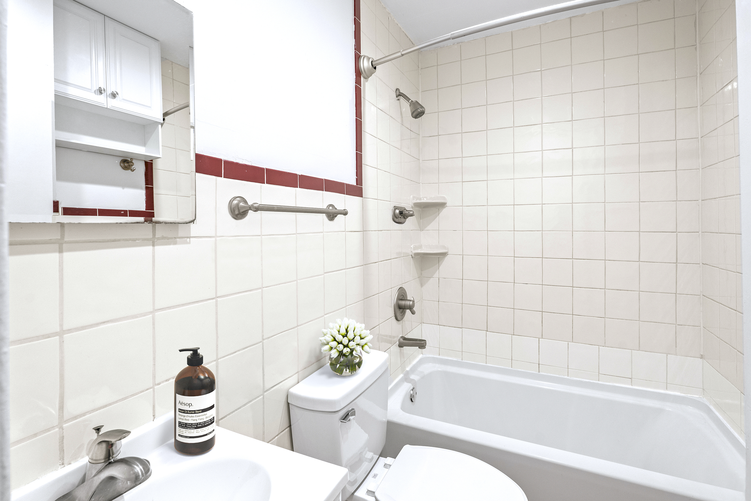 1264 Amsterdam Avenue, Unit 3D Manhattan, NY 10027 - Photo 5 of 16 a bathroom with a bathtub a sink and a toilet