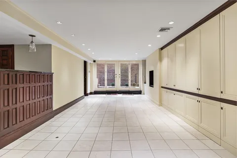 a view of an entryway wooden floor and windows