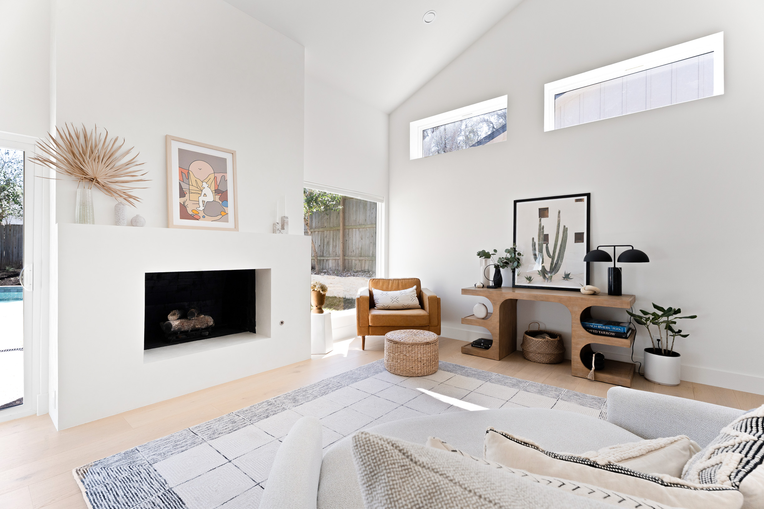 1317 Thaddeus Cove Austin, TX 78746 - Photo 5 of 22 a living room with furniture and a fireplace