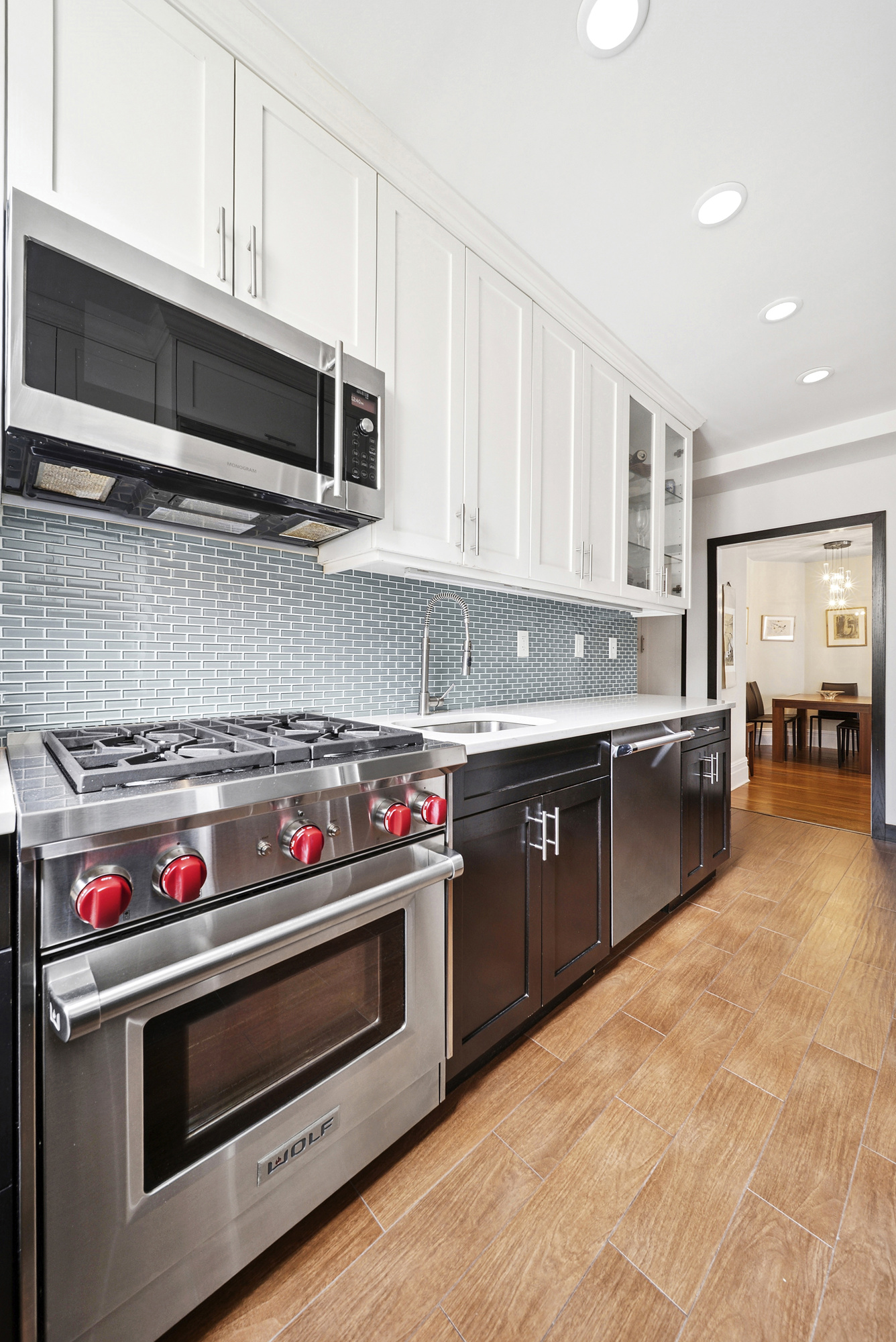514 West End Avenue, Unit 14A Manhattan, NY 10024 - Photo 3 of 9 a kitchen with stainless steel appliances kitchen island a stove and a microwave