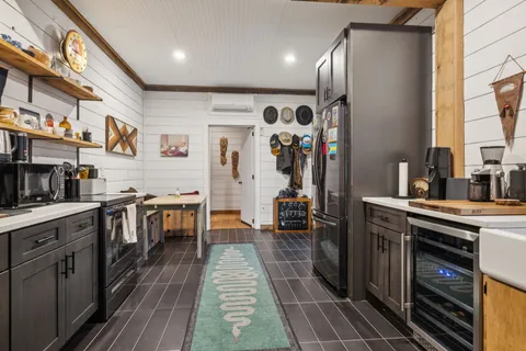 a kitchen with lots of counter top space and appliances