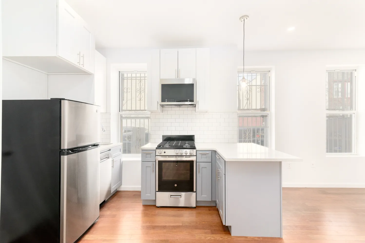 a kitchen with a stove and a refrigerator