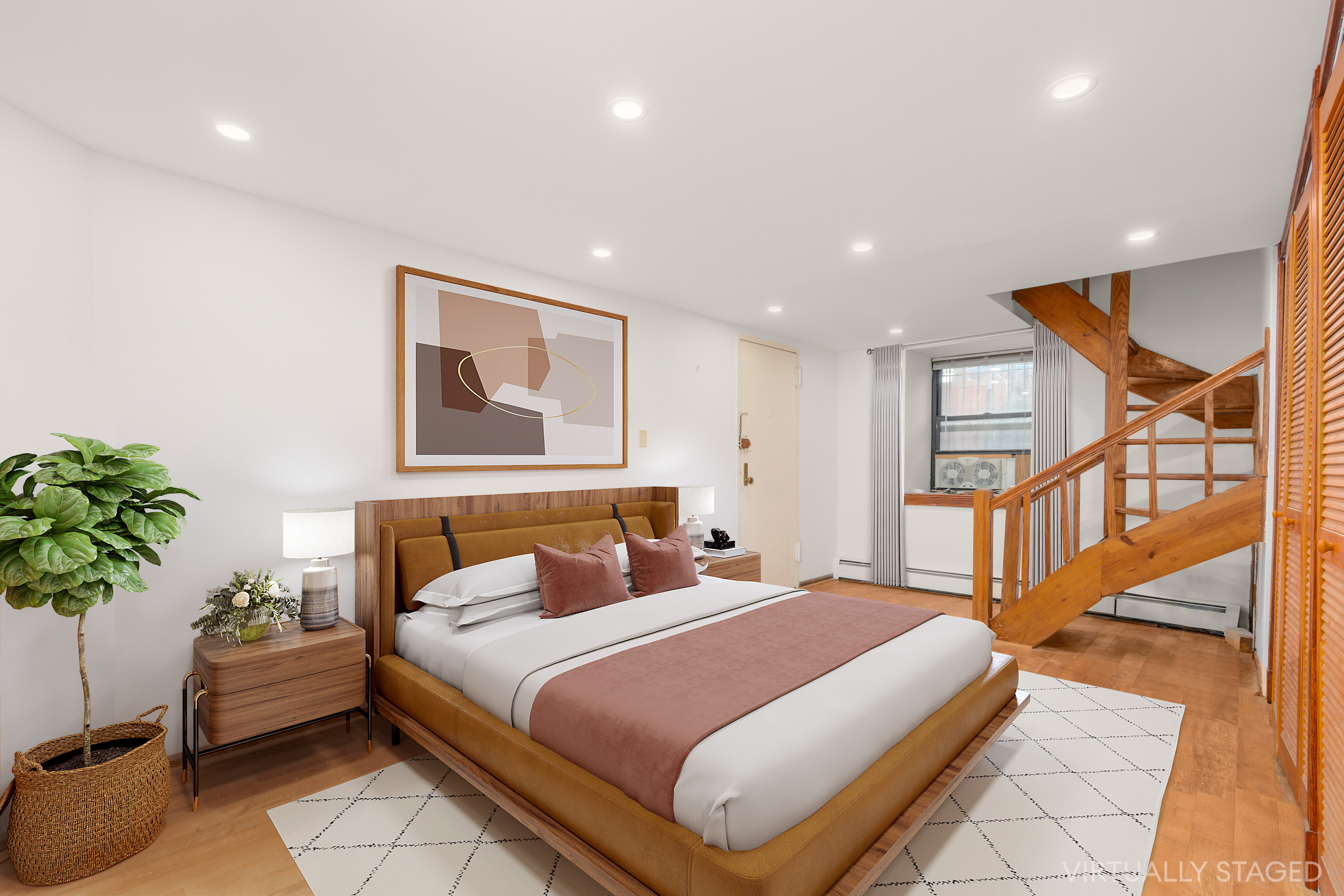 252 West 102nd Street, Unit 1 Manhattan, NY 10025 - Photo 9 of 12 a bedroom with a large bed and a potted plant