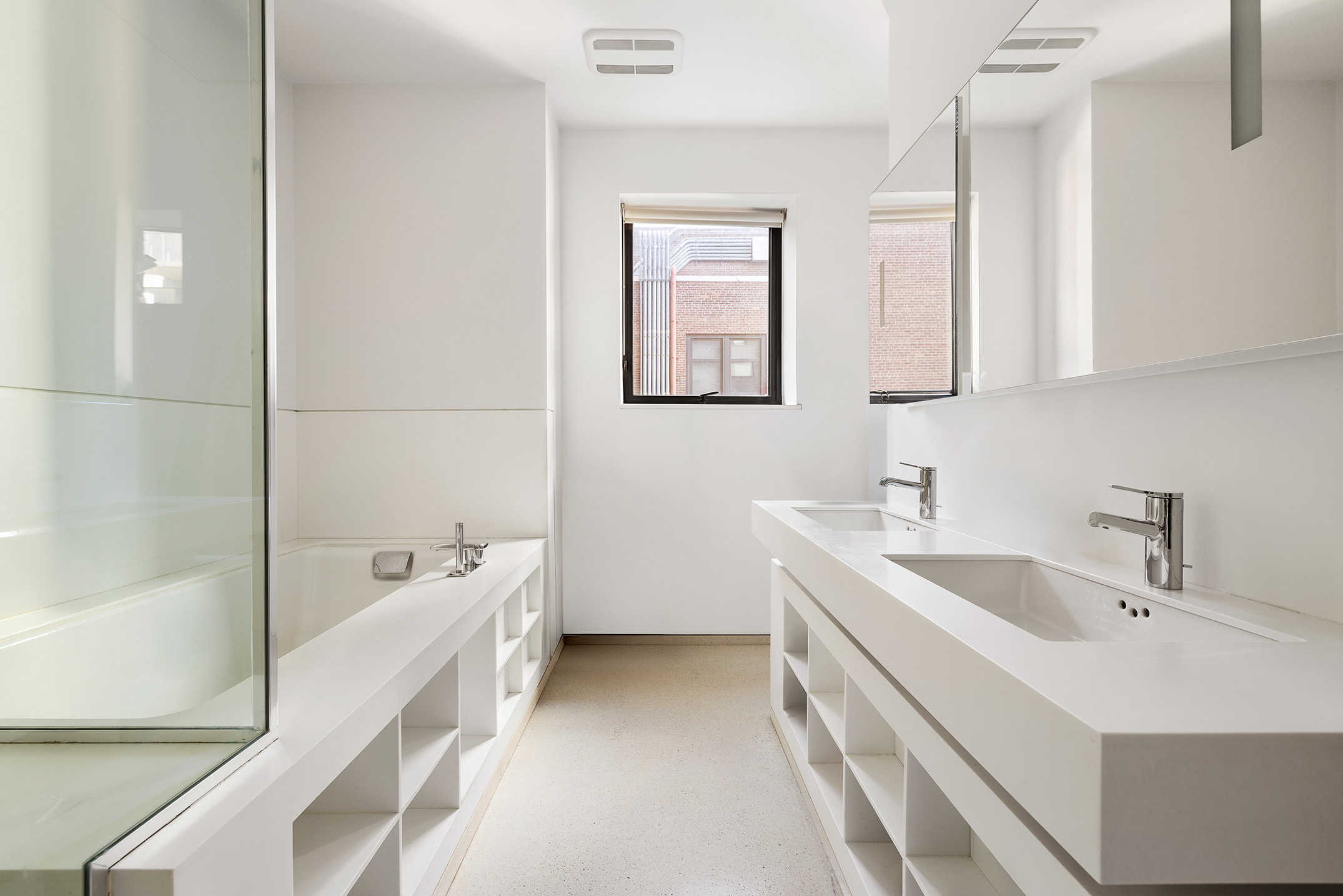100 11th Avenue, Unit 7D Manhattan, NY 10011 - Photo 6 of 15 a bathroom with a tub sink and mirror