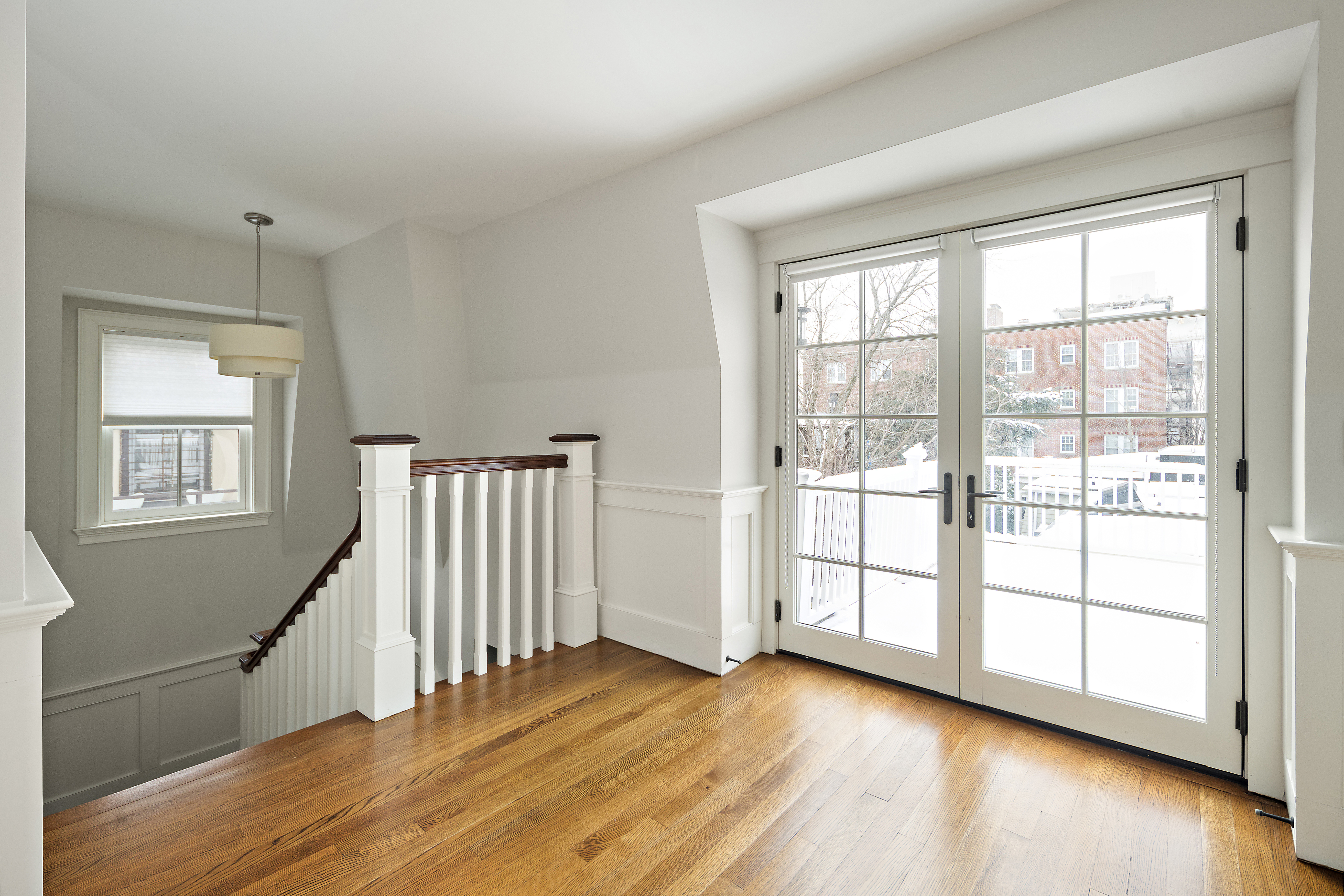 35 Willard Street Cambridge, MA 02138 - Photo 16 of 36 a view of an empty room with wooden floor and a window