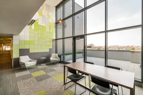 a view of a floor to ceiling window and wooden floor