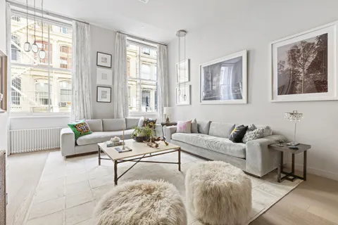 a living room with furniture and windows