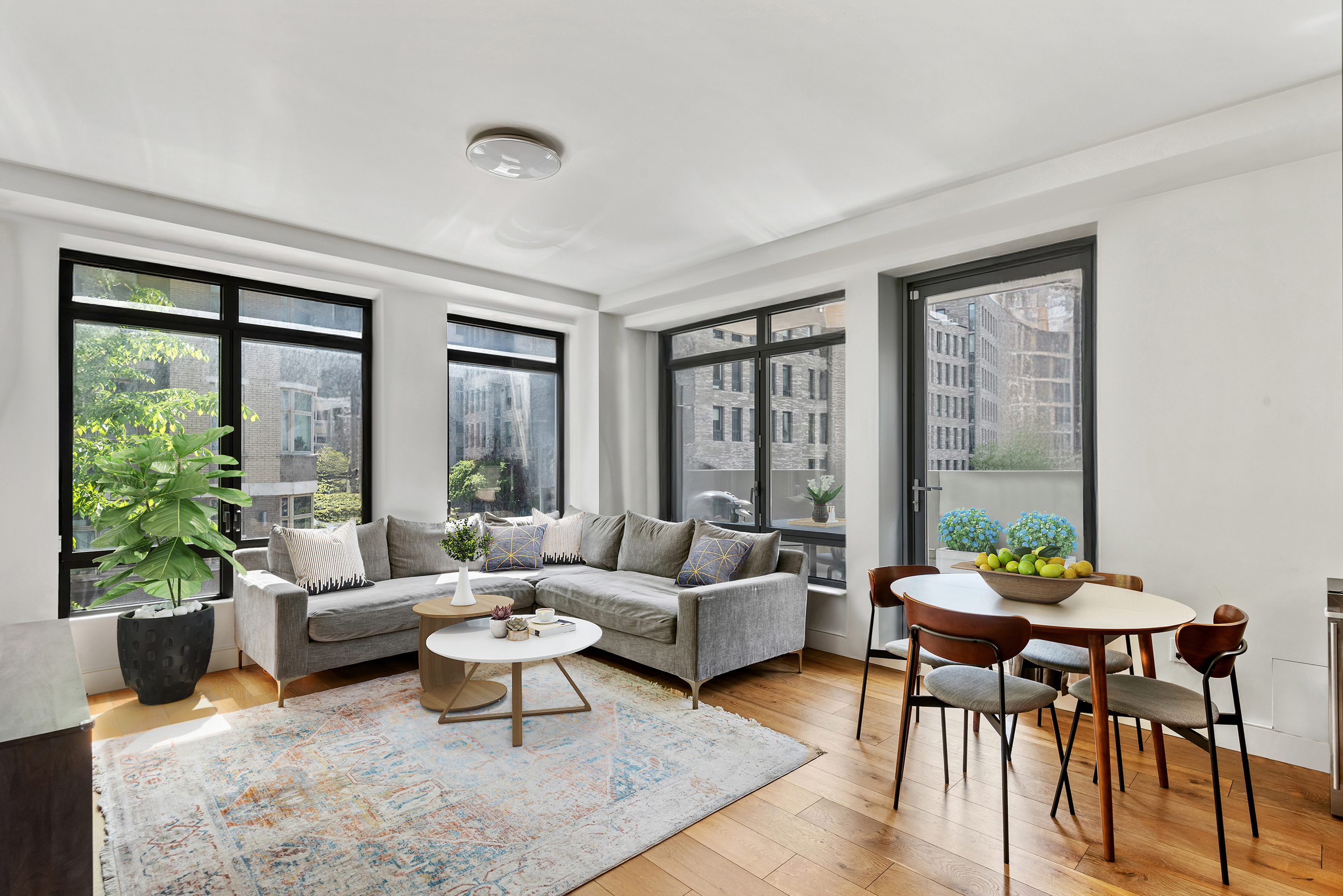 147 Hope Street, Unit 2D Brooklyn, NY 11211 - Photo 1 of 13 a living room with furniture and a large window