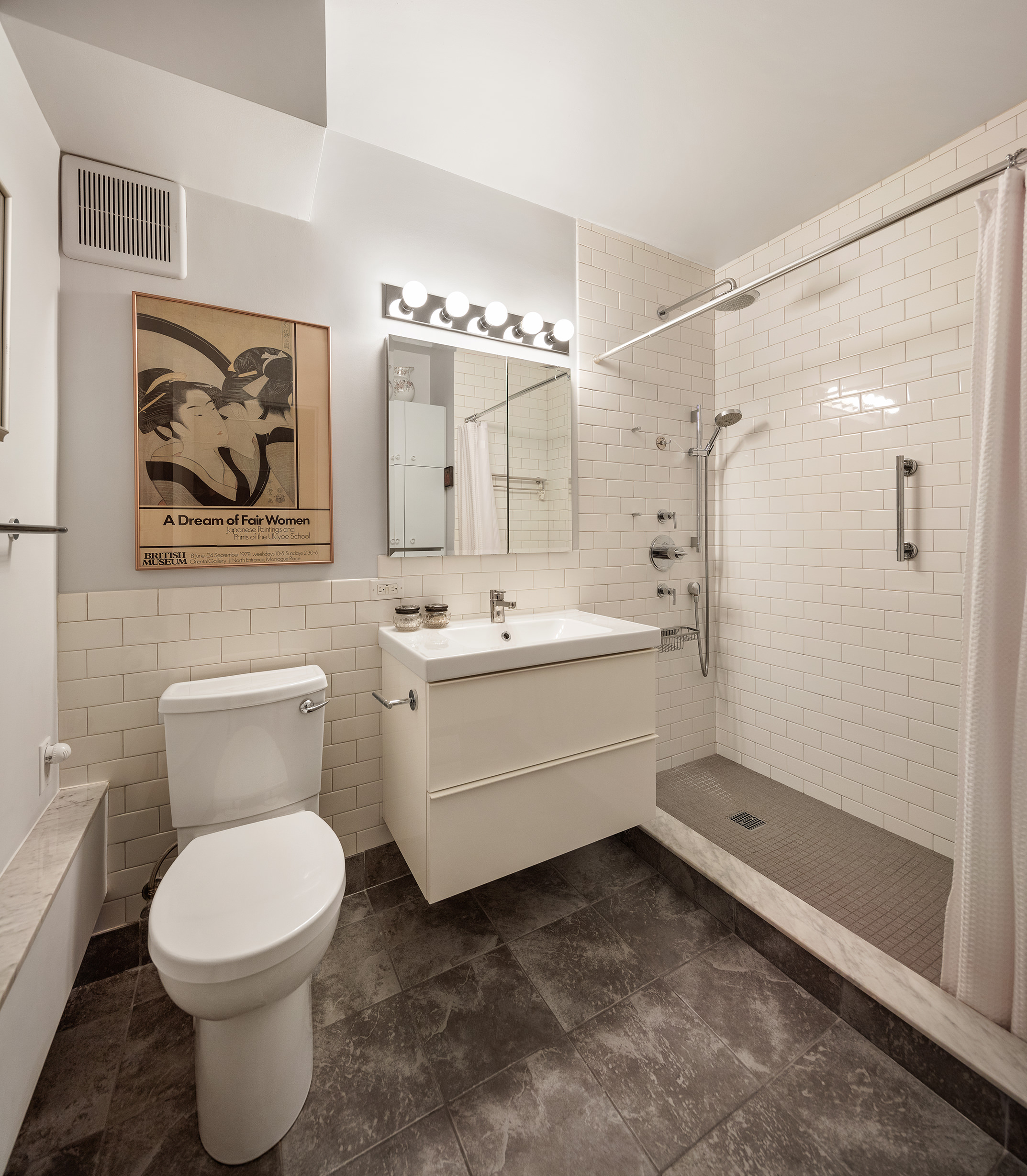 240 West 23rd Street, Unit 5A Manhattan, NY 10011 - Photo 6 of 7 a bathroom with a toilet sink and shower