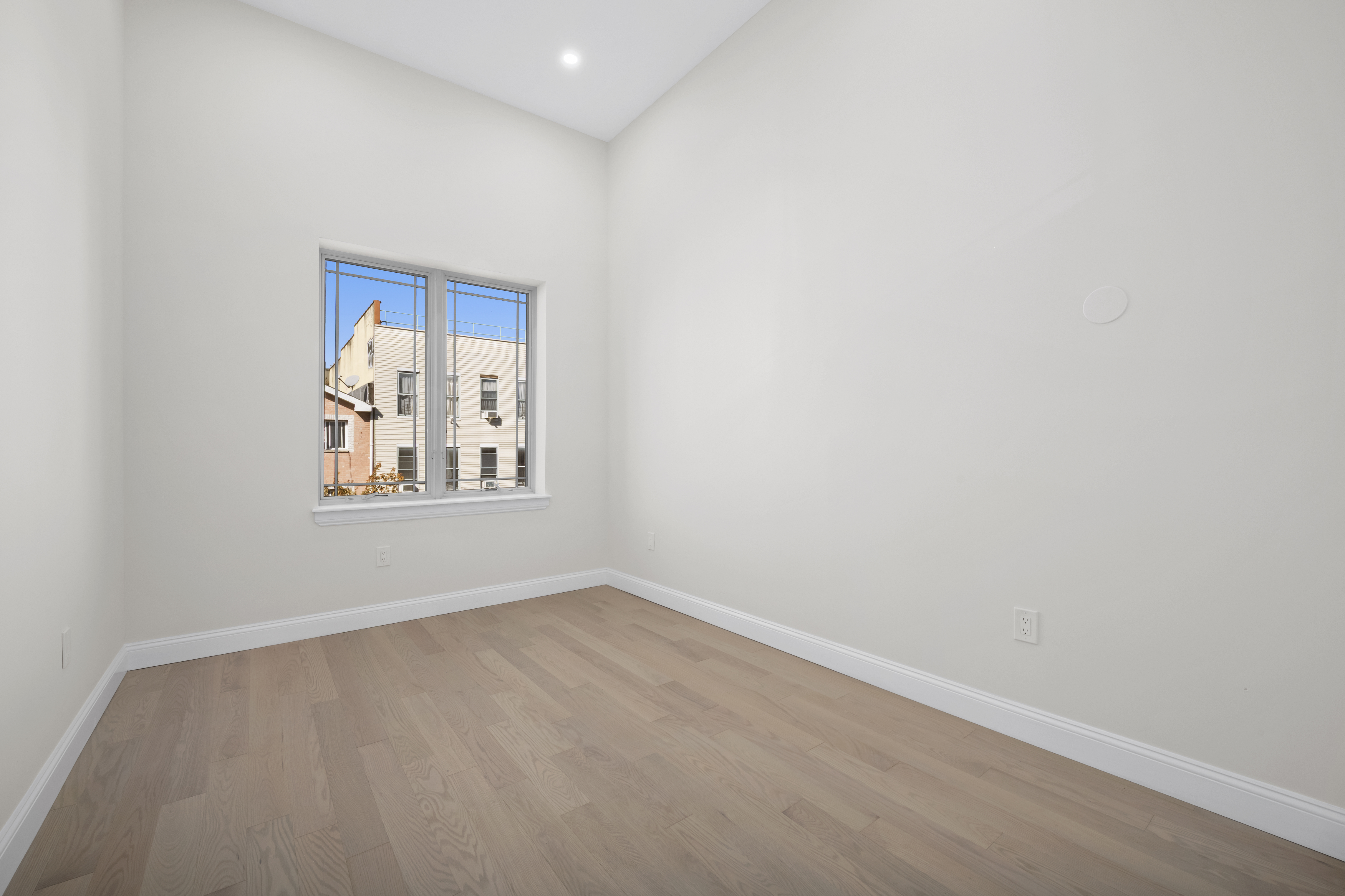 84 Himrod Street Brooklyn, NY 11221 - Photo 19 of 35 a view of an empty room with a window
